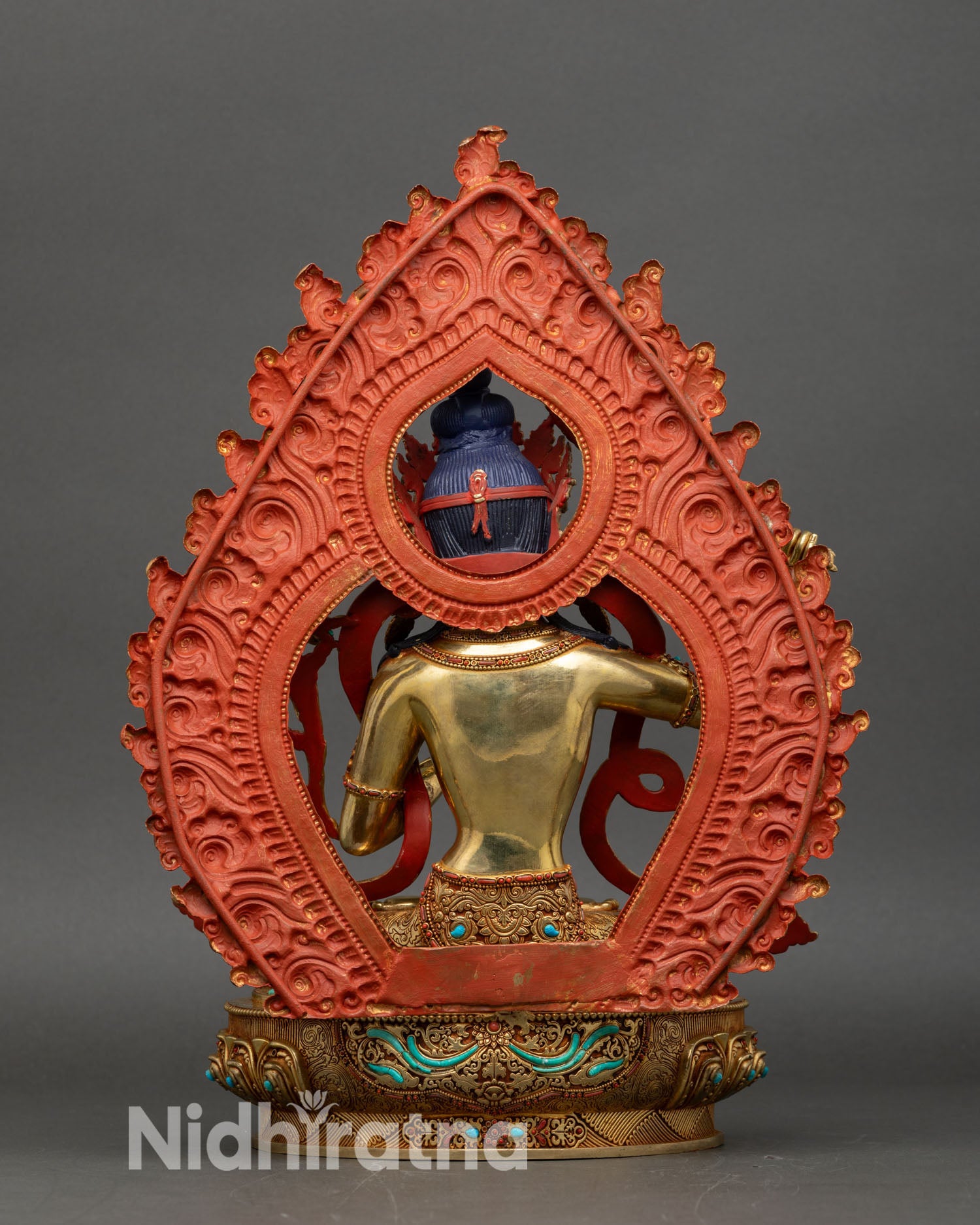 manjushri statue back view, ornate torana lotus base nepalese art