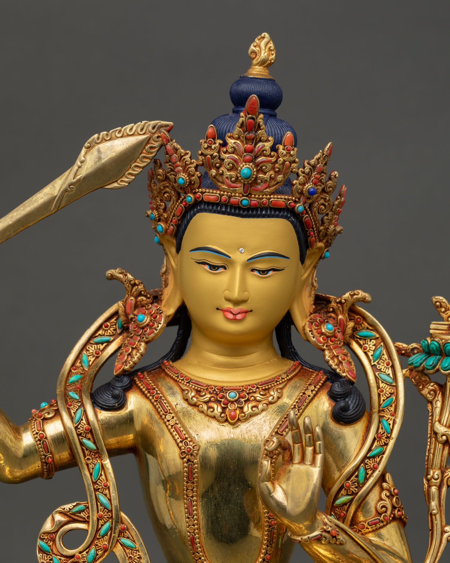 manjushri statue close up, handcrafted copper buddhist art nepal