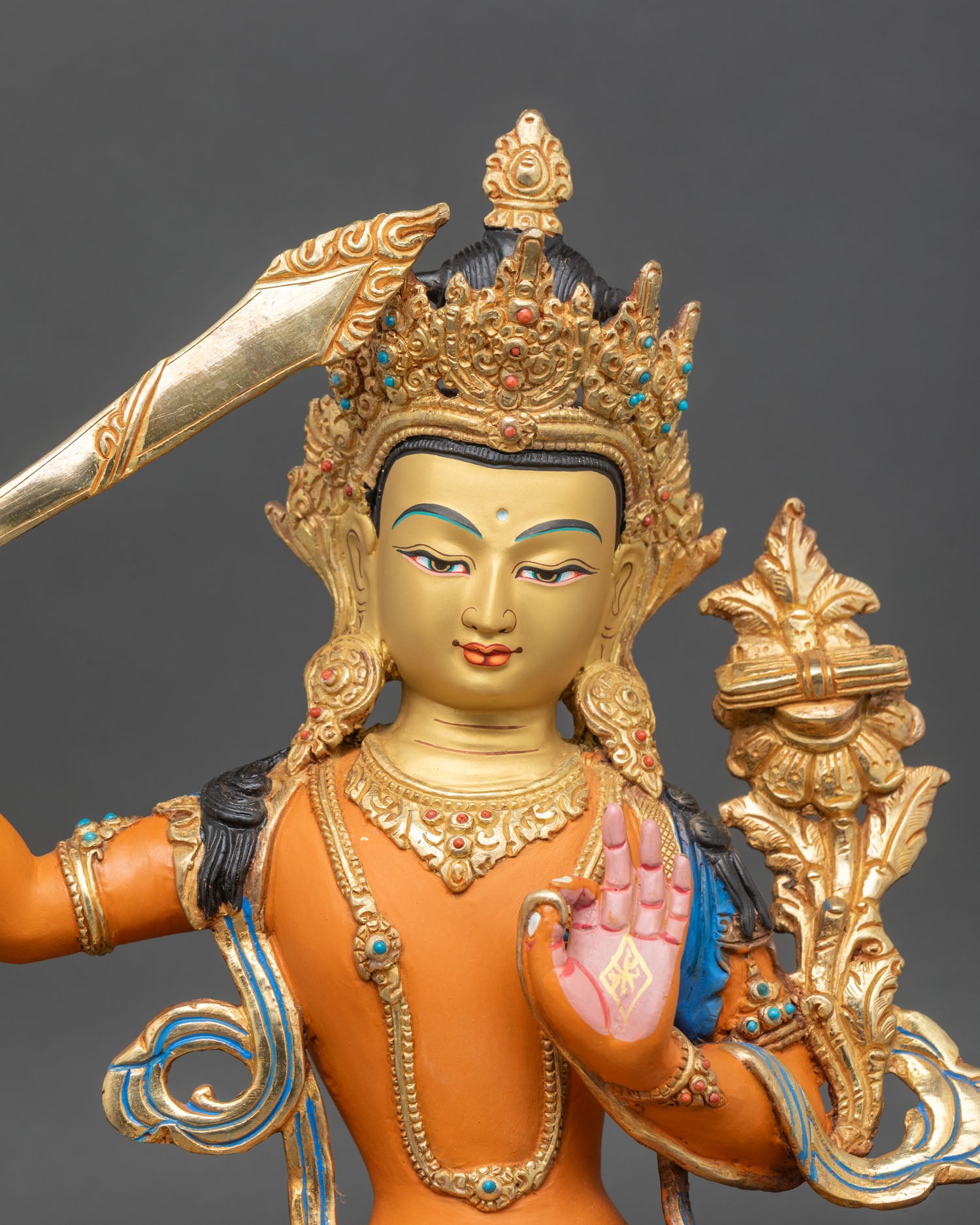 Manjushri Statue close up showing multicoloured garments and fine craftsmanship