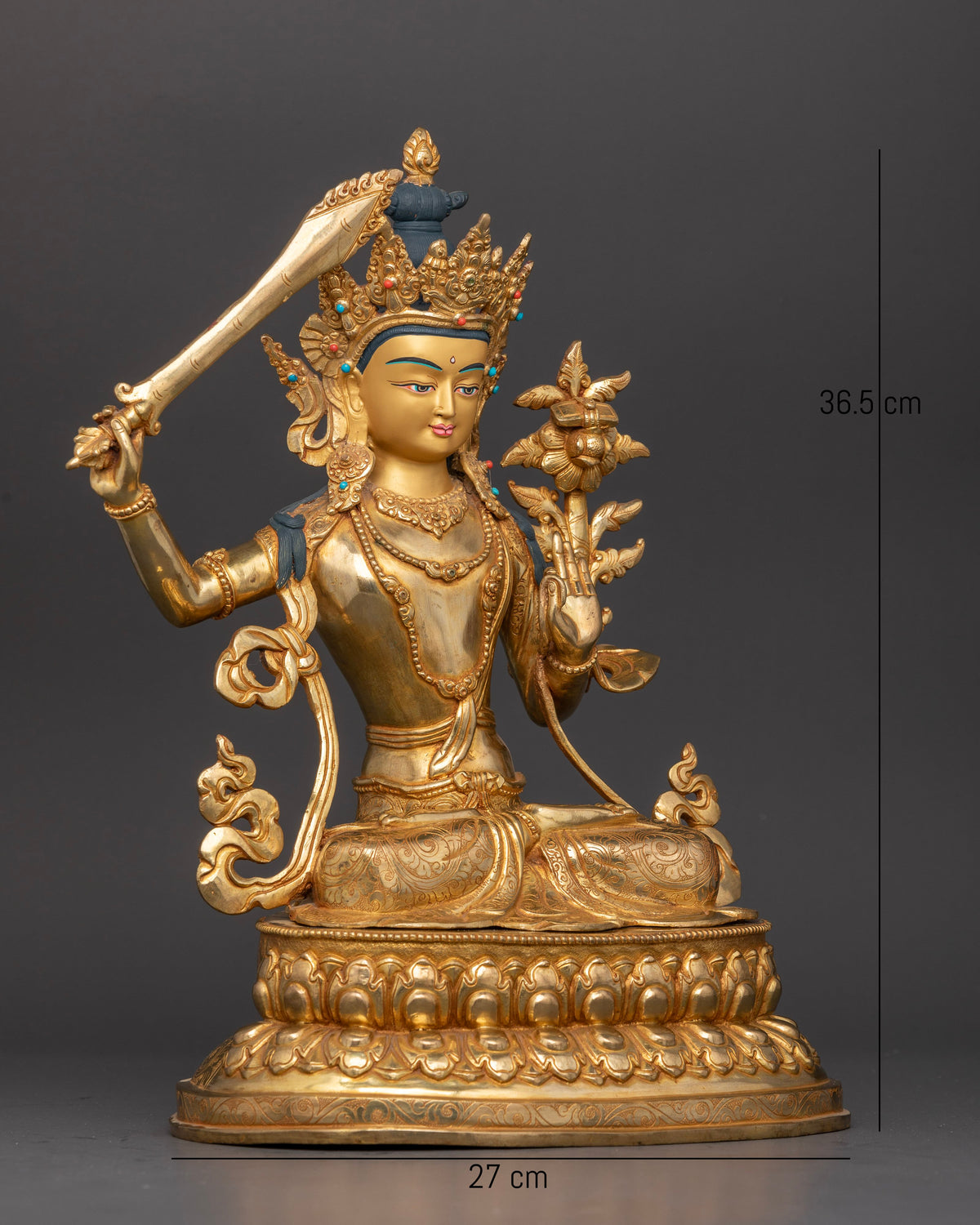 Manjushri statue flaming sword Prajnaparamita Sutra wisdom deity detail.
