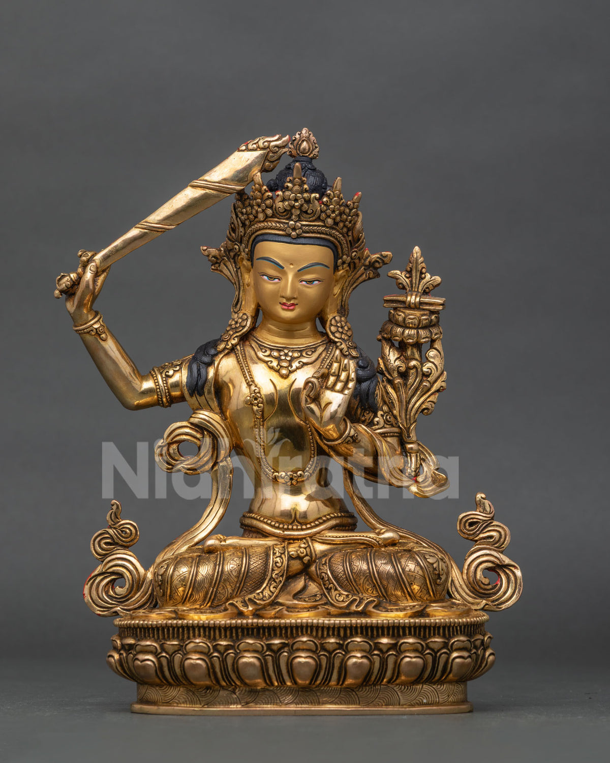 Manjushri statue from patan nepal with copper body and gold fire gilded finish.