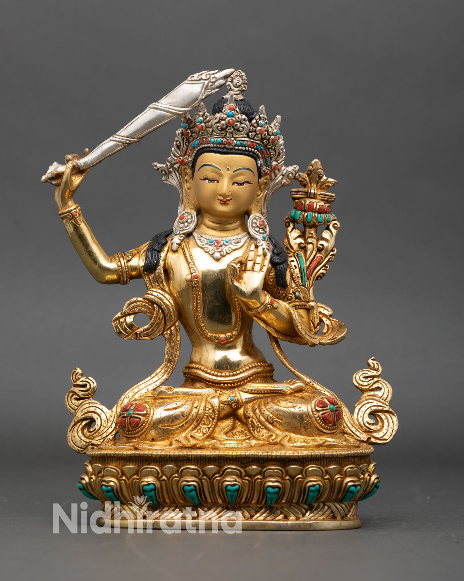 manjushri statue front view, gold gilded nepalese buddhist art on lotus pedestal