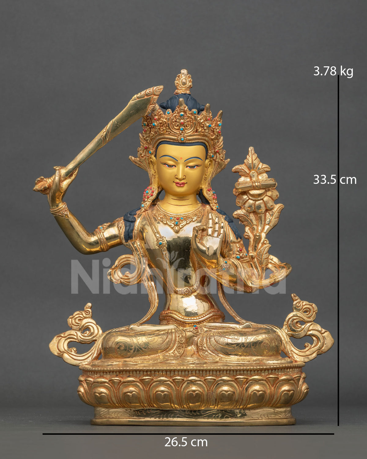 Manjushri statue gold fire gilded copper Patan Nepal.