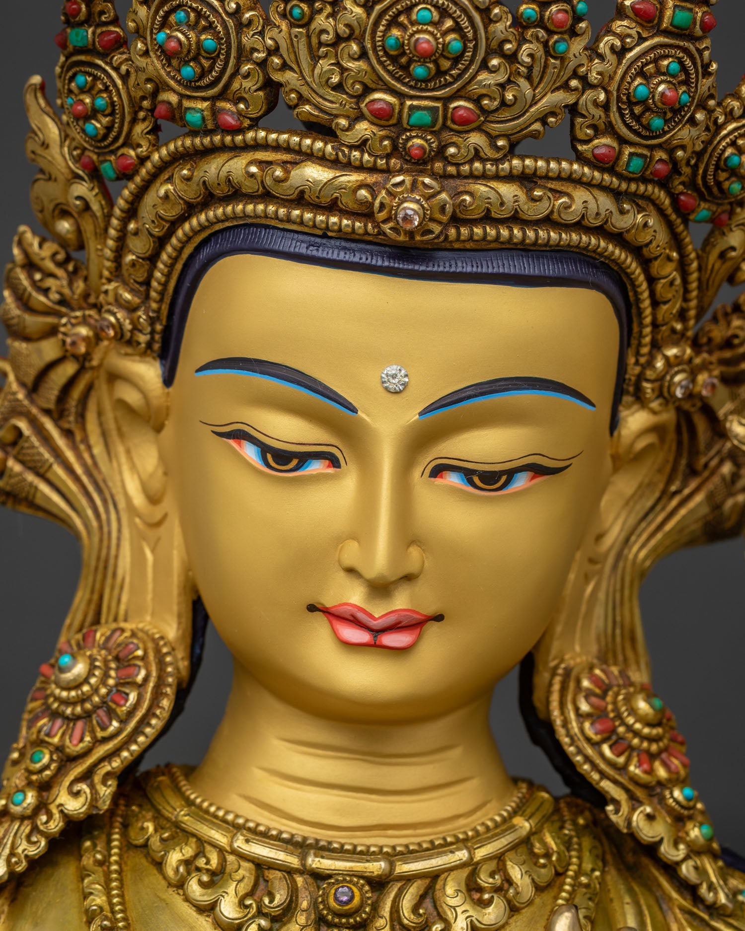 Manjushri statue gold painted face with jewel details Nepal