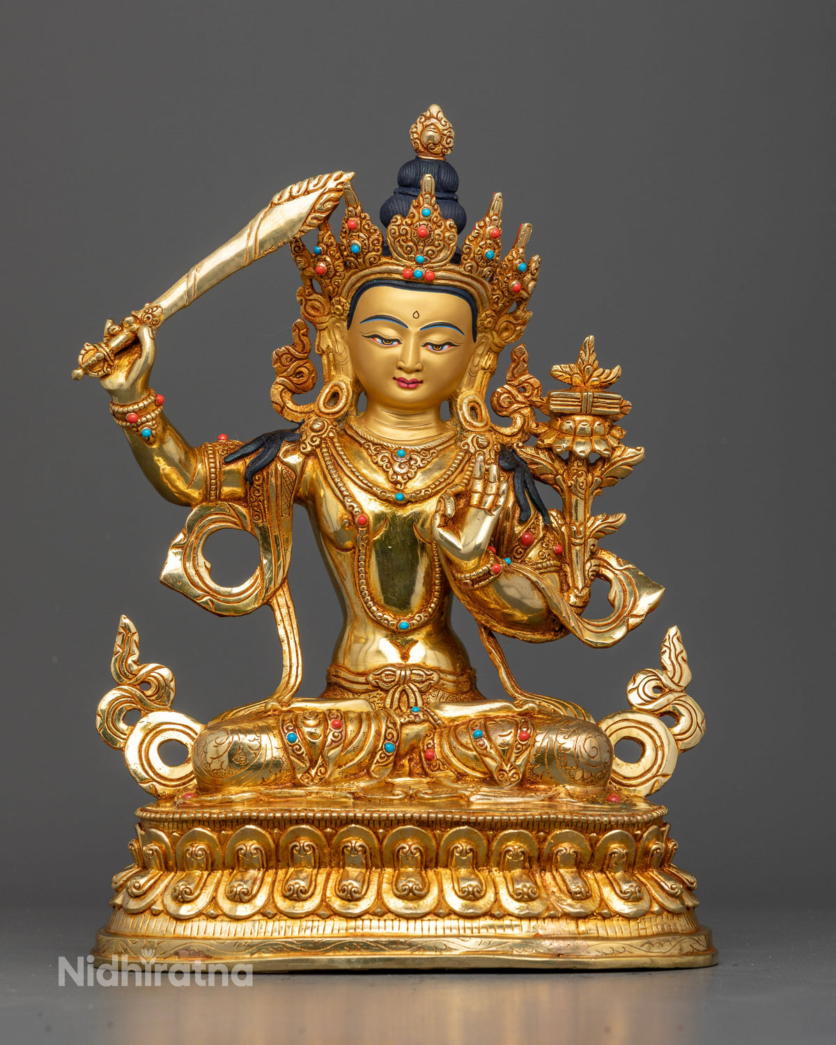 Manjushri statue handcrafted Newari artist Patan Nepal copper gold fire gilded 24K gold painted face.