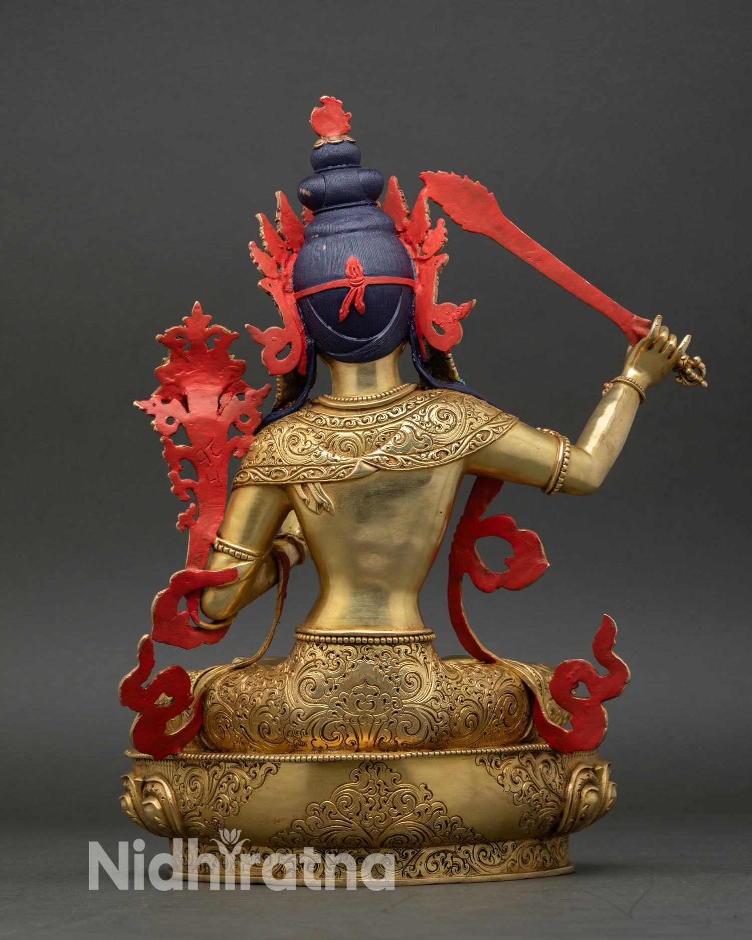 Manjushri statue Himalayan Buddhist art piece crafted in copper with traditional lost wax detailing gold gilded finish