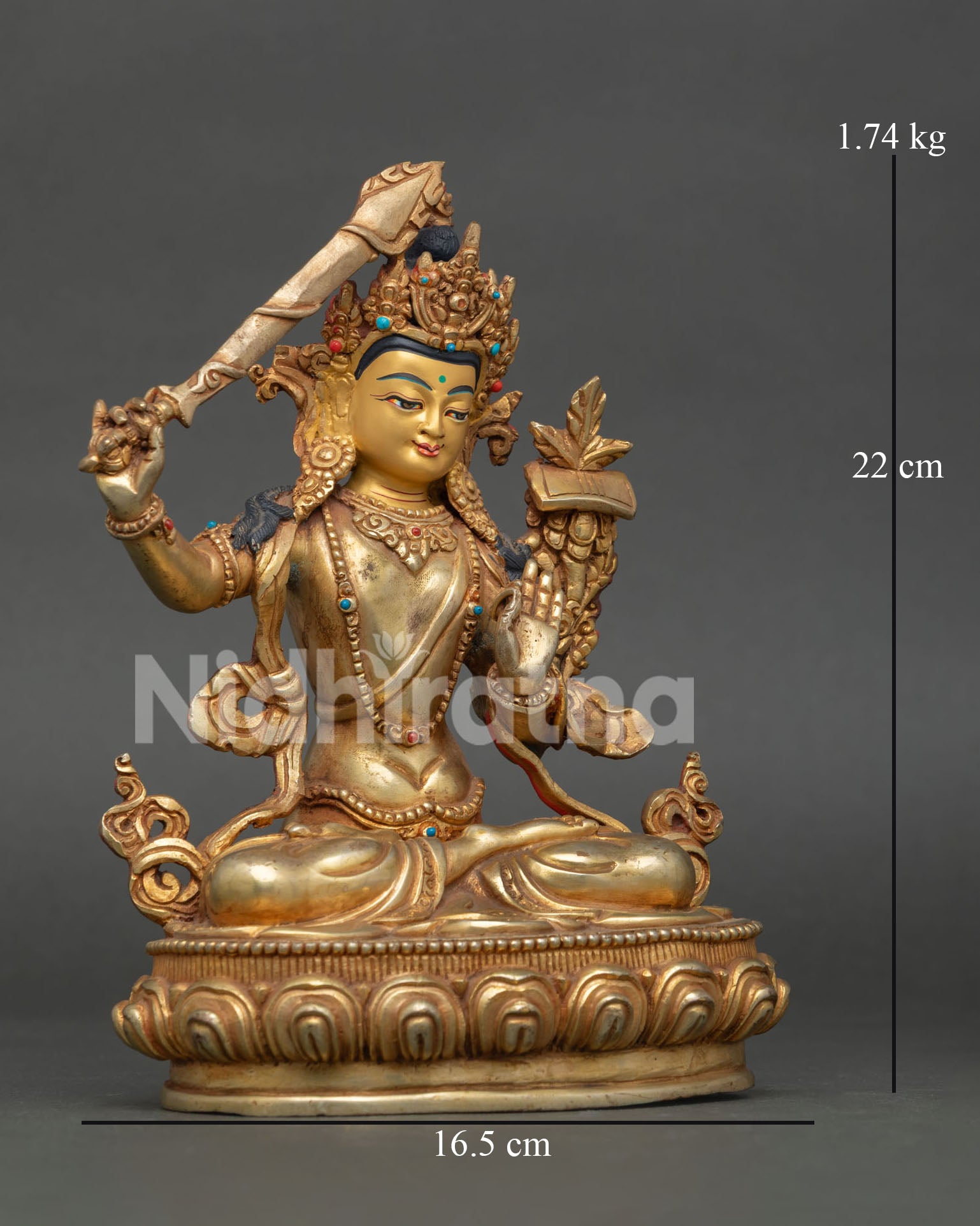 Manjushri Statue, holding the flaming sword of transcendent wisdom and the sacred Prajnaparamita Sutra.