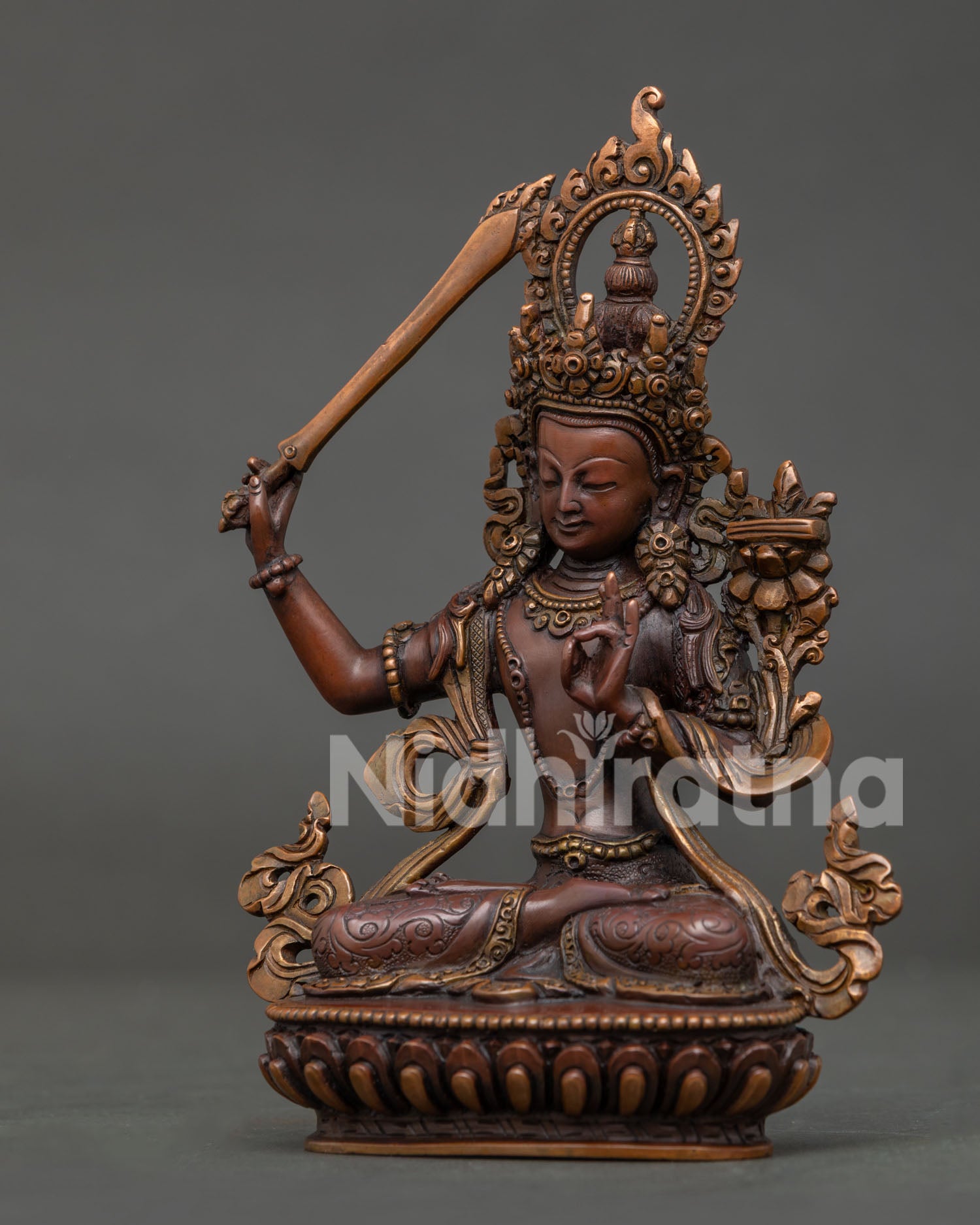 Manjushri Statue with Prajnaparamita Sutra and floral silk garment.