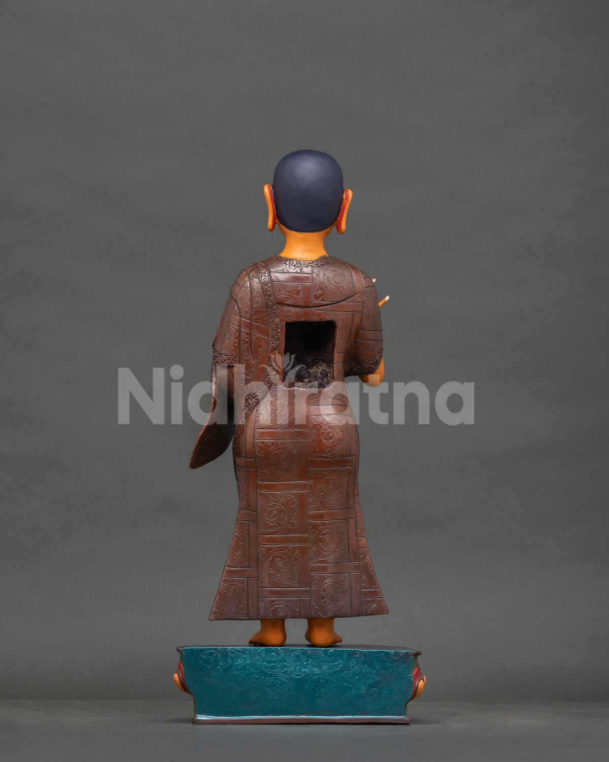 Maudgalyayana copper statue back view, engraved robe and lotus base