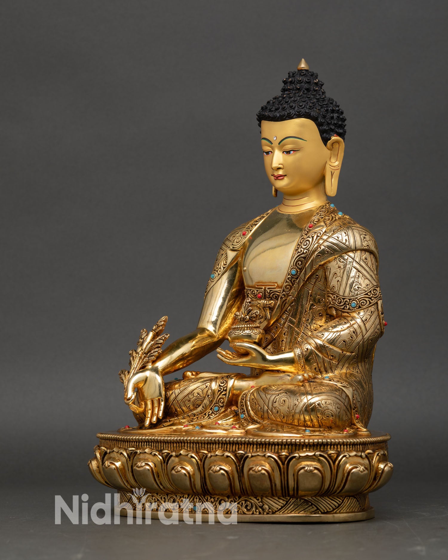 Medicine Buddha left profile view, Bhaisajyaguru statue with myrobalan detail, traditional Nepalese Buddhist art