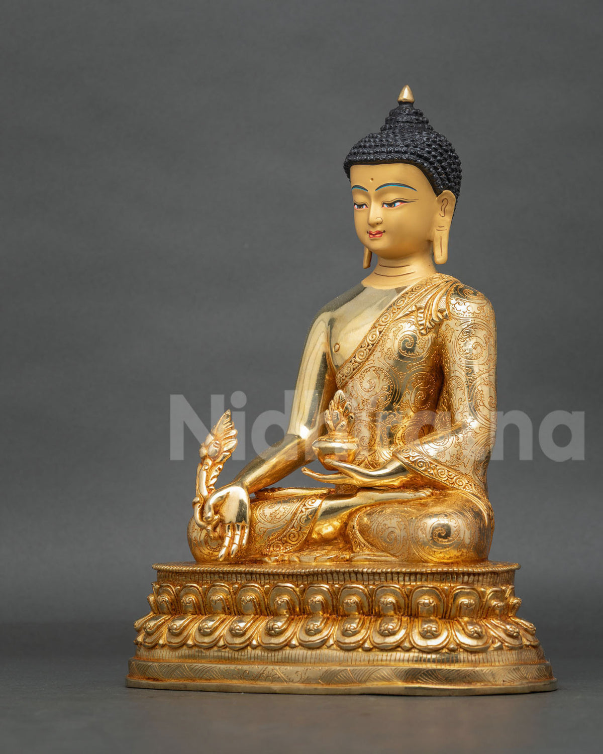 Medicine Buddha seated on a lotus pedestal holding a myrobalan plant stem and nectar bowl, symbolizing healing, compassion, and spiritual well-being.