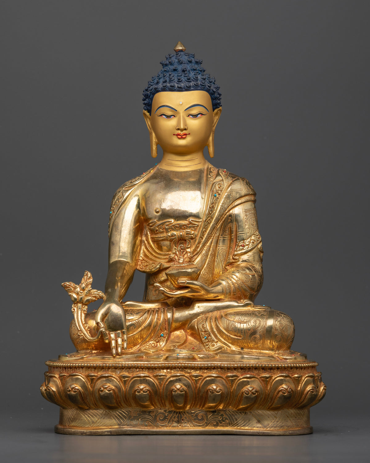 Medicine Buddha Statue front view featuring gold fire gilded copper 24K gold painted face and lotus pedestal.