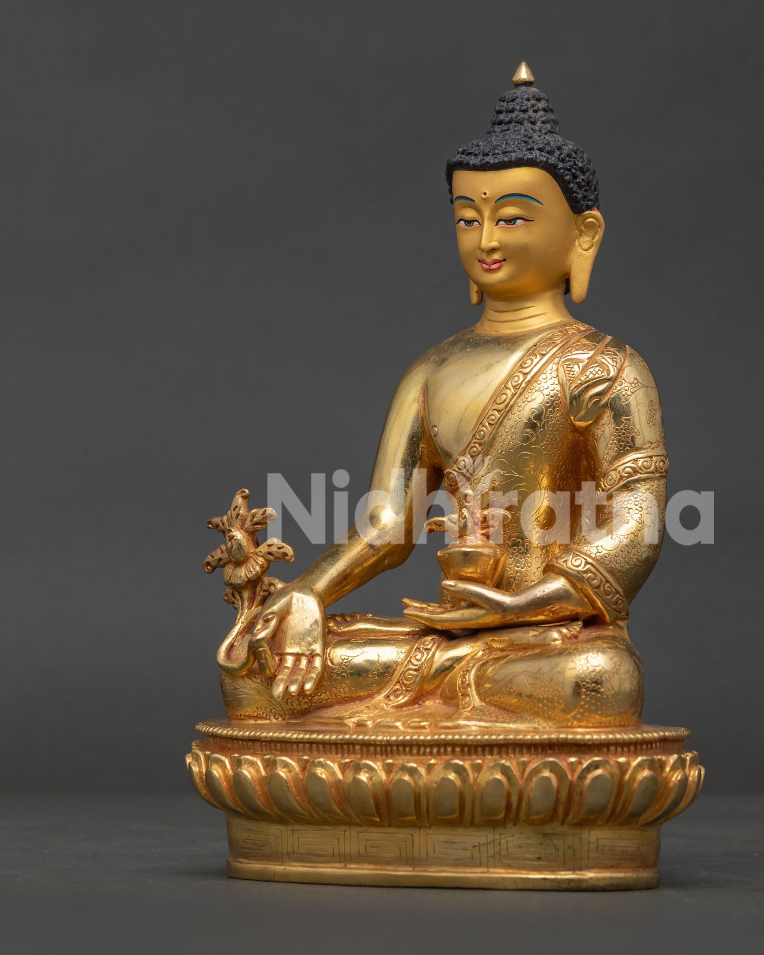 Medicine Buddha statue handcrafted by Newari artisans in Patan Nepal with gold fire gilding.