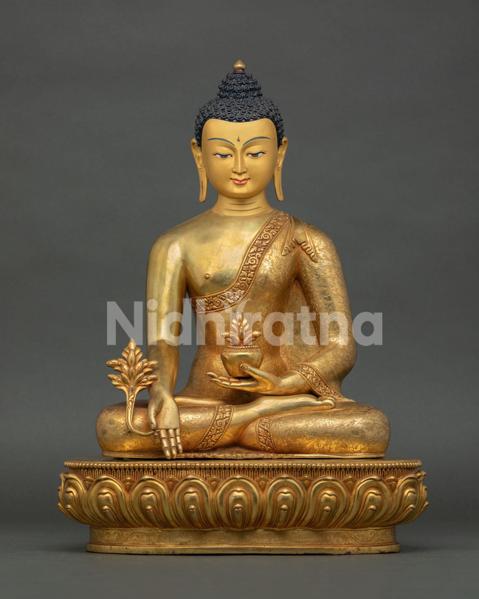 medicine buddha statue handcrafted in nepal with fire-gilded copper and lotus throne