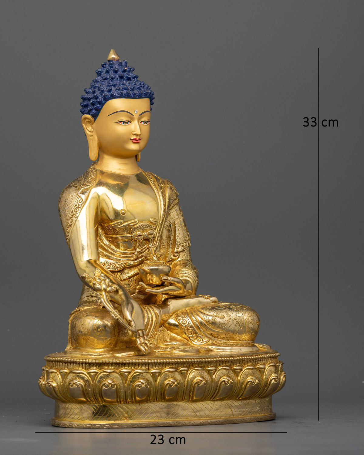 Medicine Buddha statue holding myrobalan plant stem in right hand.