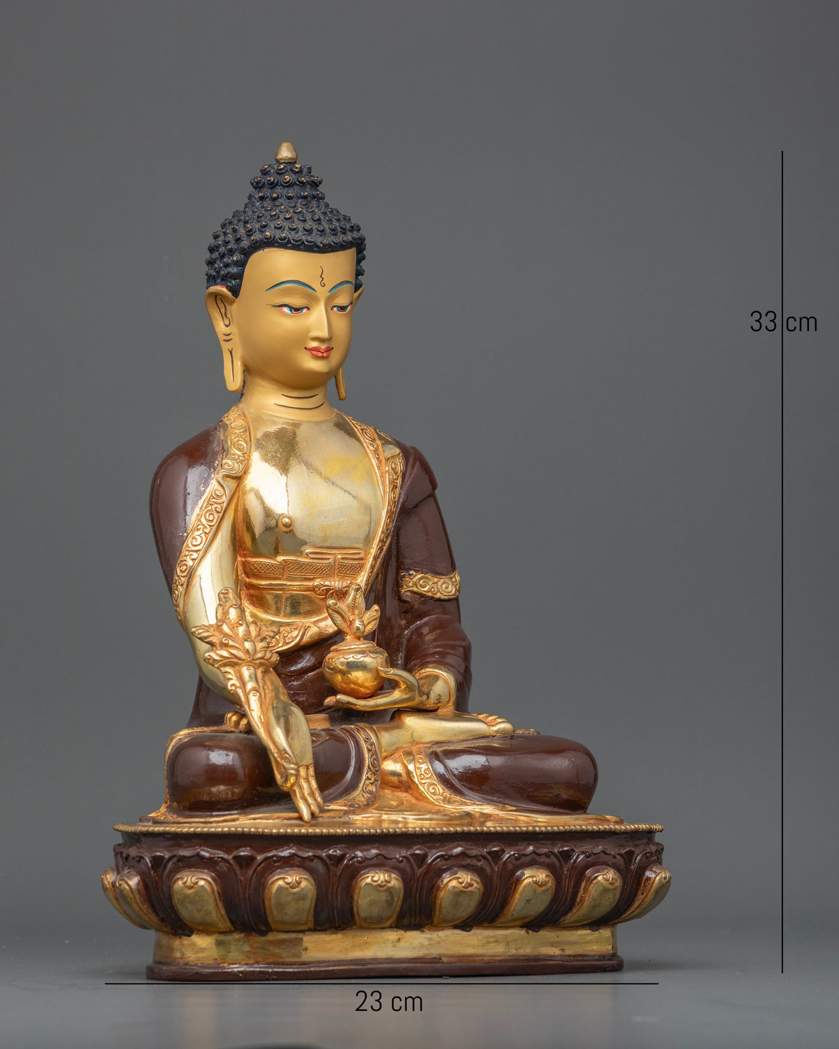 Medicine Buddha statue seated on a hand carved lotus pedestal with intricate details.