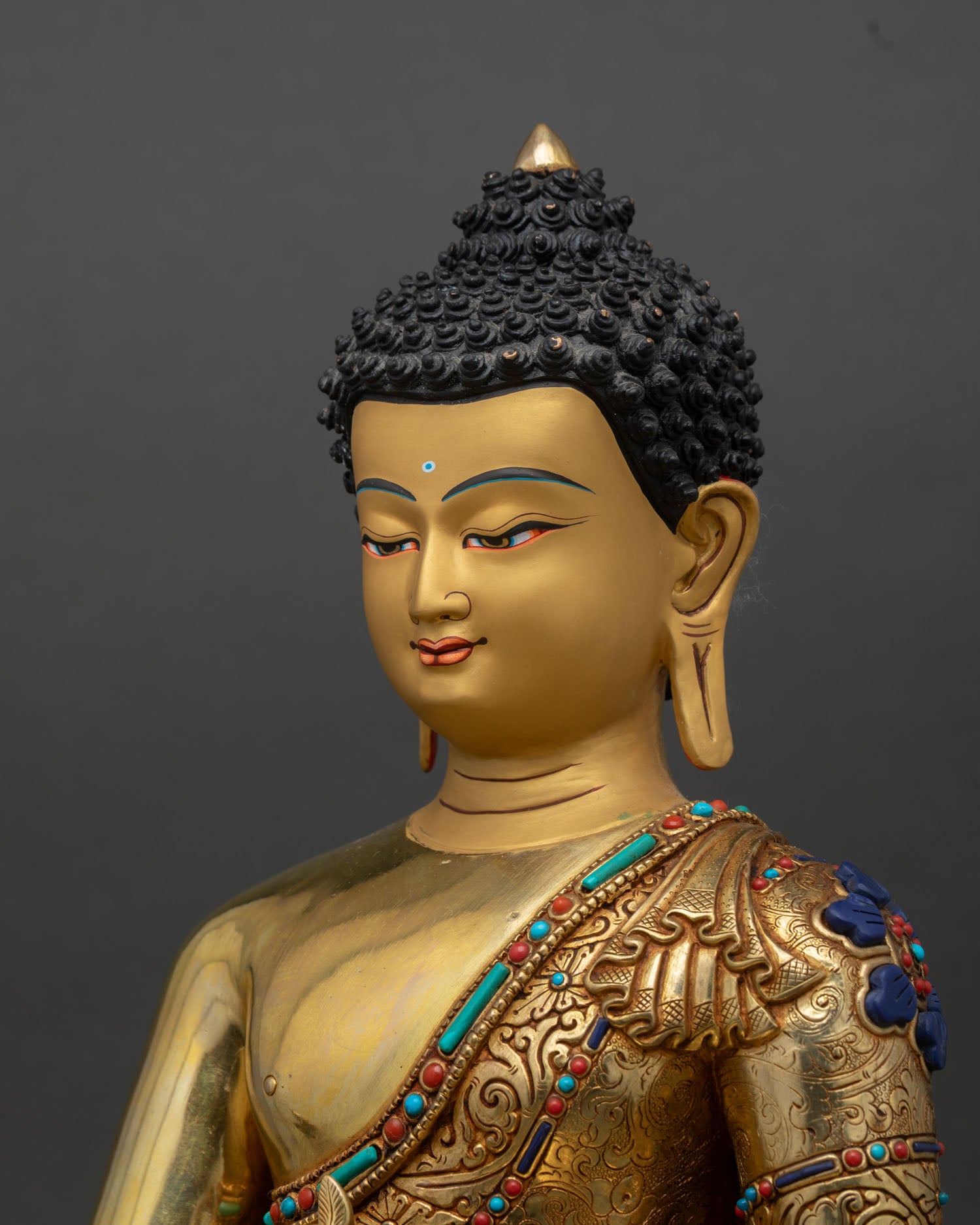 Medicine Buddha statue side close up, Sangye Menla figure on lotus throne with fine engraved Himalayan metalwork