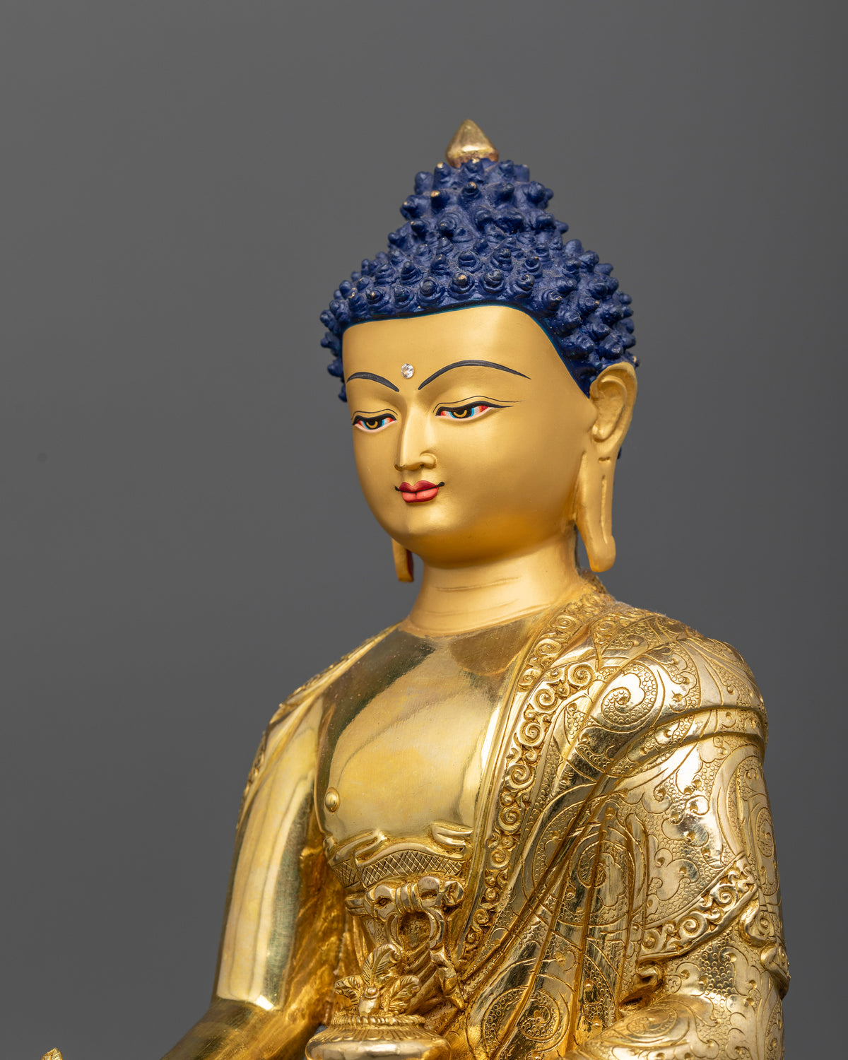 Medicine Buddha statue with hand carved floral monk robe and lotus pedestal.