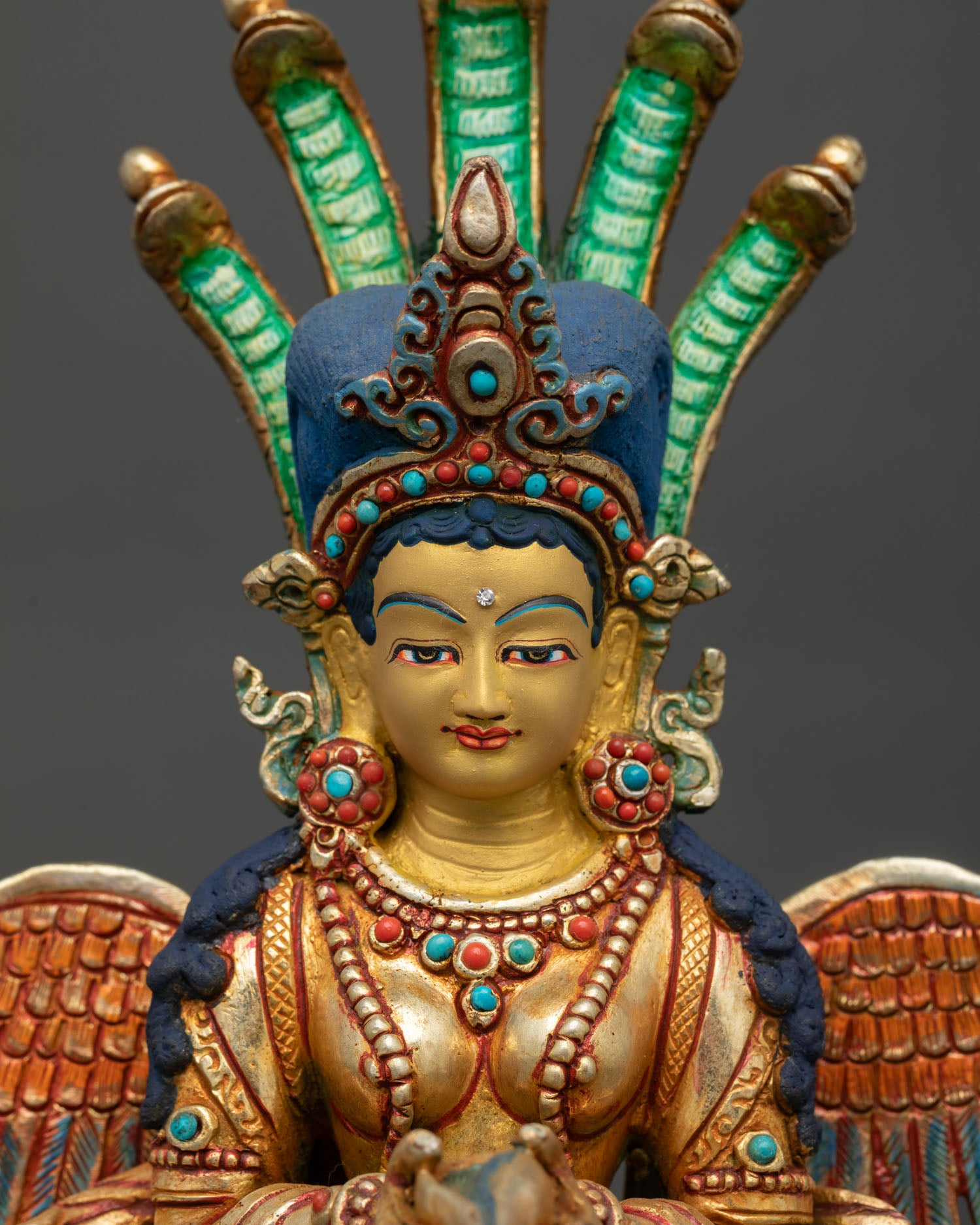 naga kanya statue regular close up, detailed view of acrylic painted copper body with gold gilded upper form and cobra hood