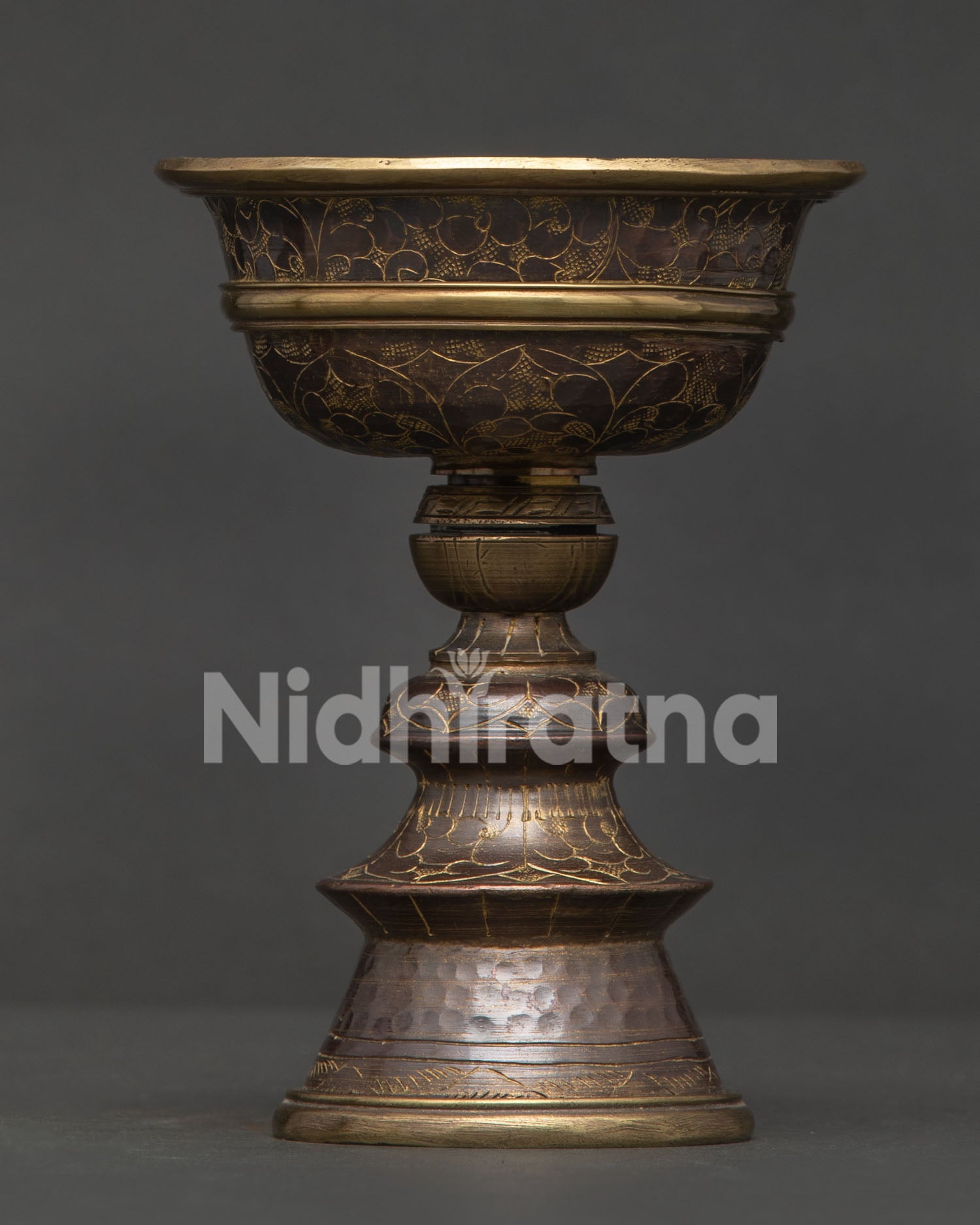 Nepalese Buddhist butter lamps showing traditional Newari metal craftsmanship