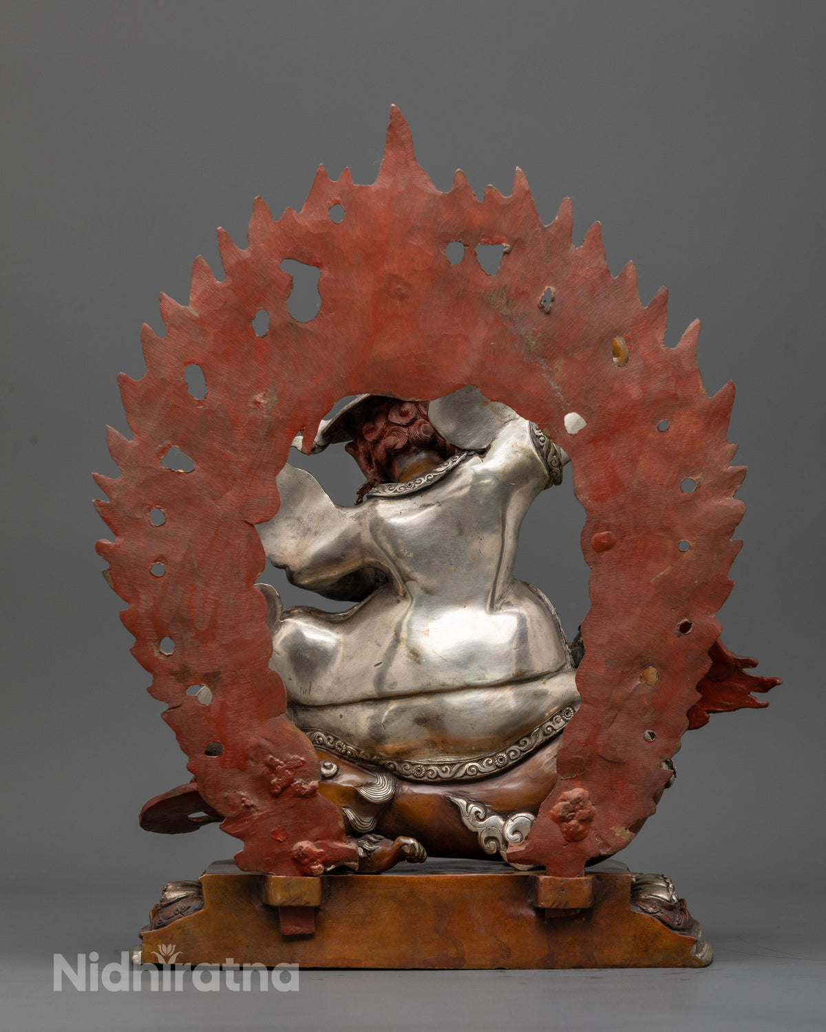Nepalese Dorje Legpa statue with radiant halo and commanding Buddhist protector form