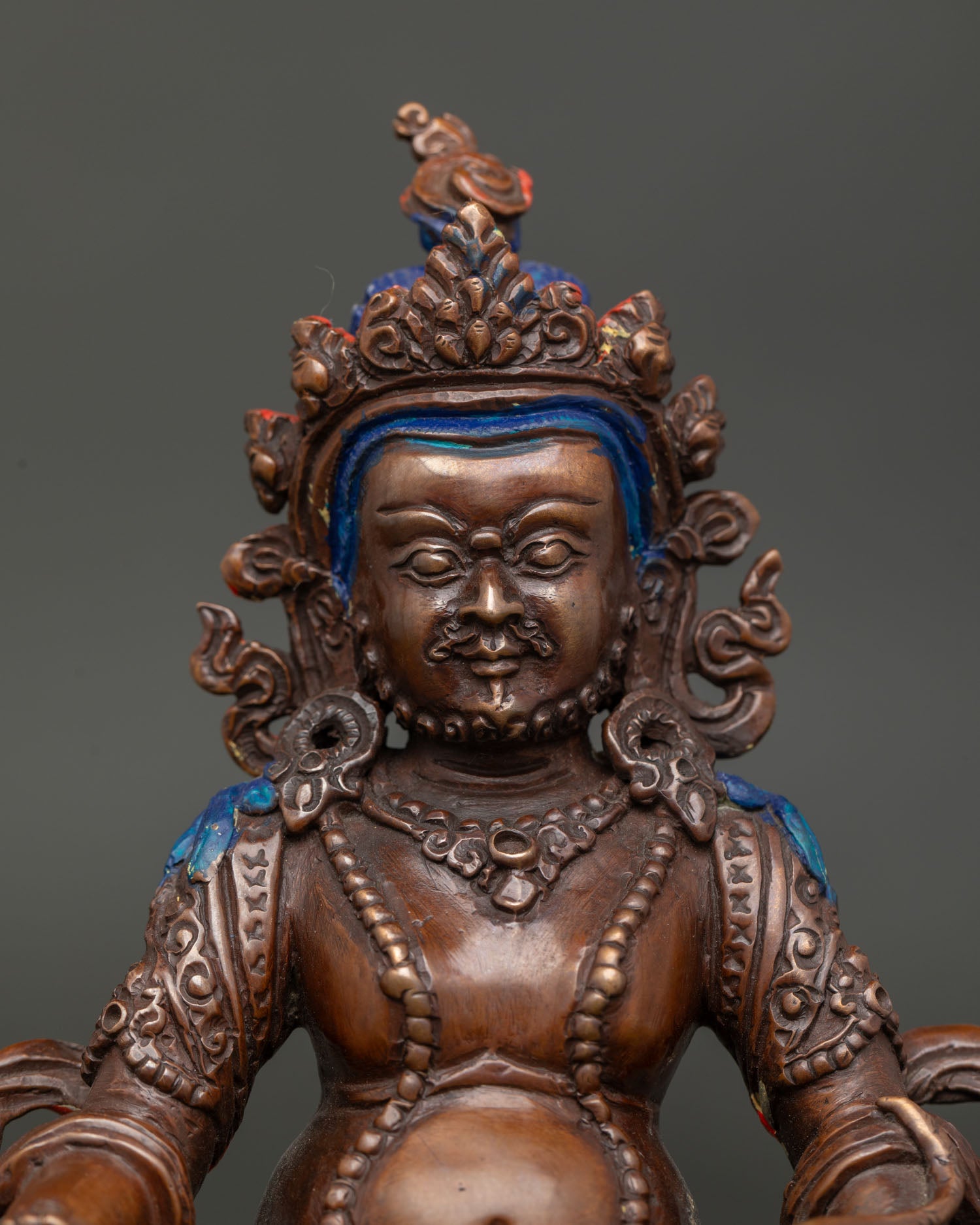 Nepalese Dzambhala artwork created using lost wax casting with a fierce yet benevolent expression