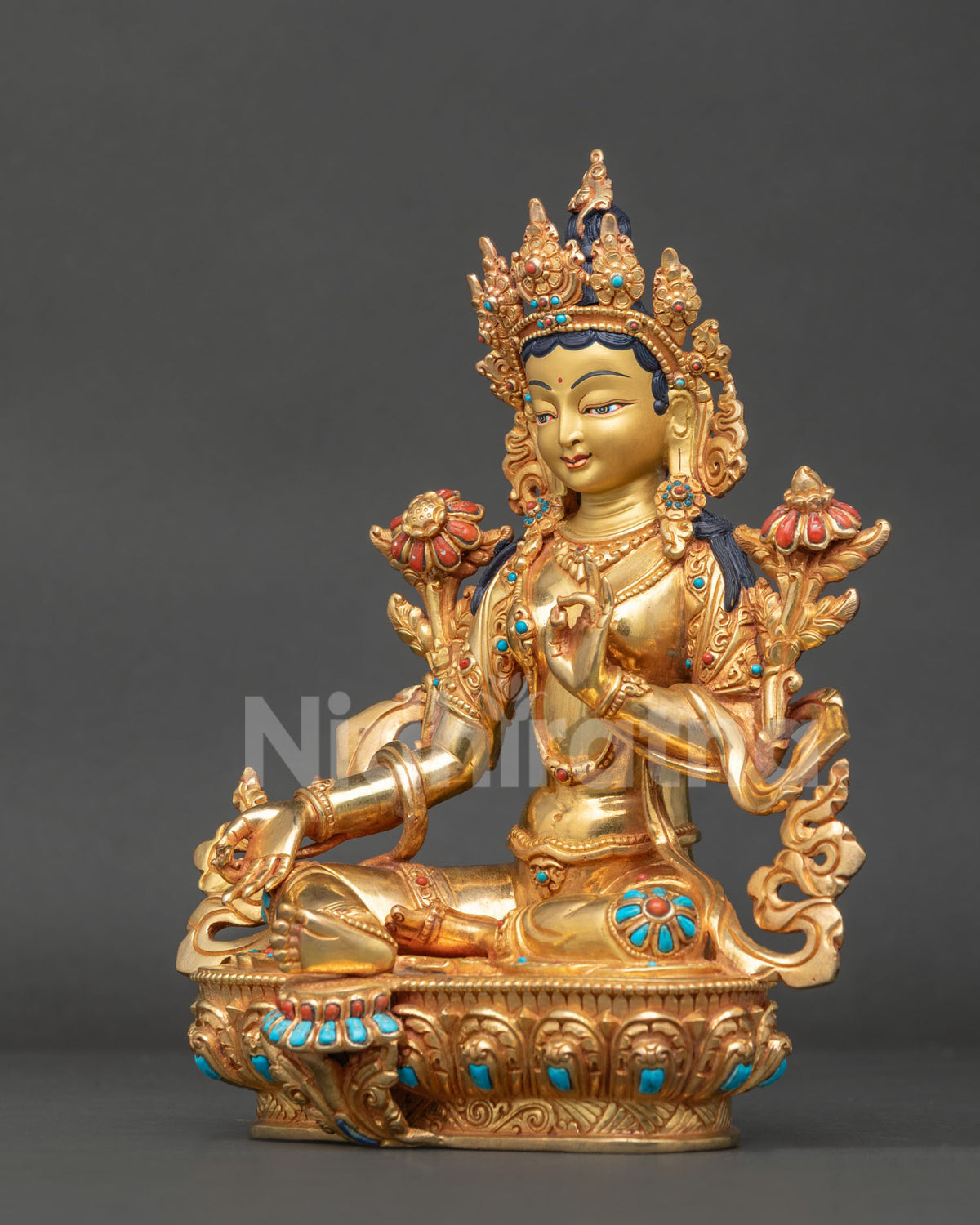 Nepalese Green Tara Buddhist statue showing Varada and Abhaya Mudra with intricate copper craftsmanship.