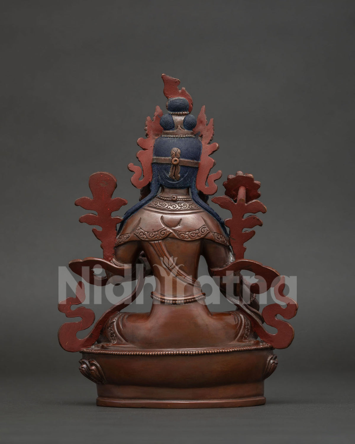 Nepalese Green Tara sculpture in lalitasana posture with richly embellished garments.