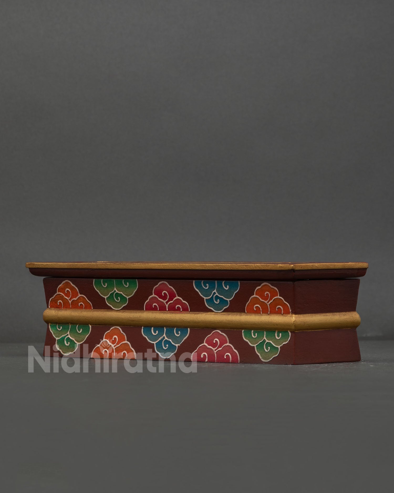 Nepalese wooden incense burner with vibrant hand painted cloud artwork