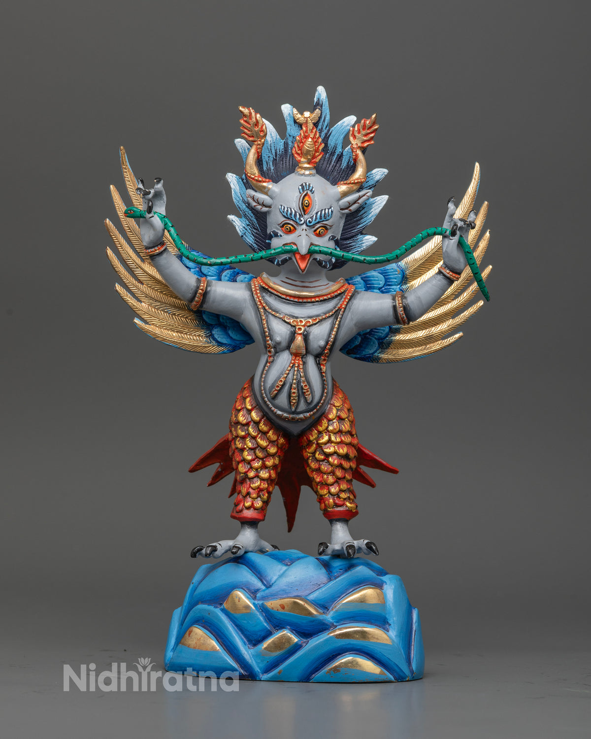 Nepali garuda statue with powerful talons and dynamic standing posture.