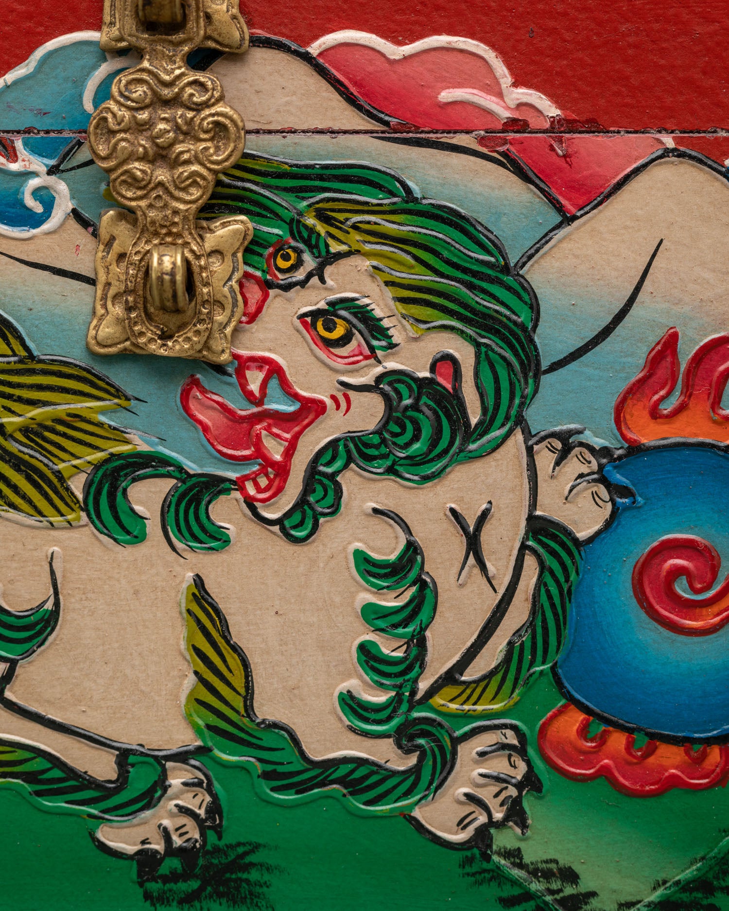 Ornate sacred storage box with snow lions and traditional Himalayan artwork