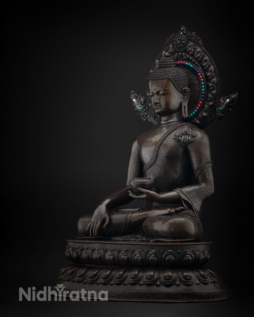 Left side view of oxidized copper Shakyamuni Buddha statue