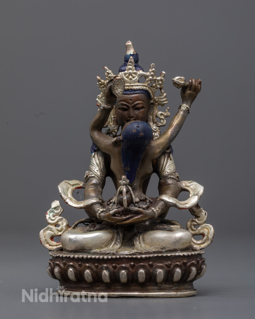 oxidized copper Amitayus Buddha Consort statue showing intricate carvings on the floating robe and silver-plated crown