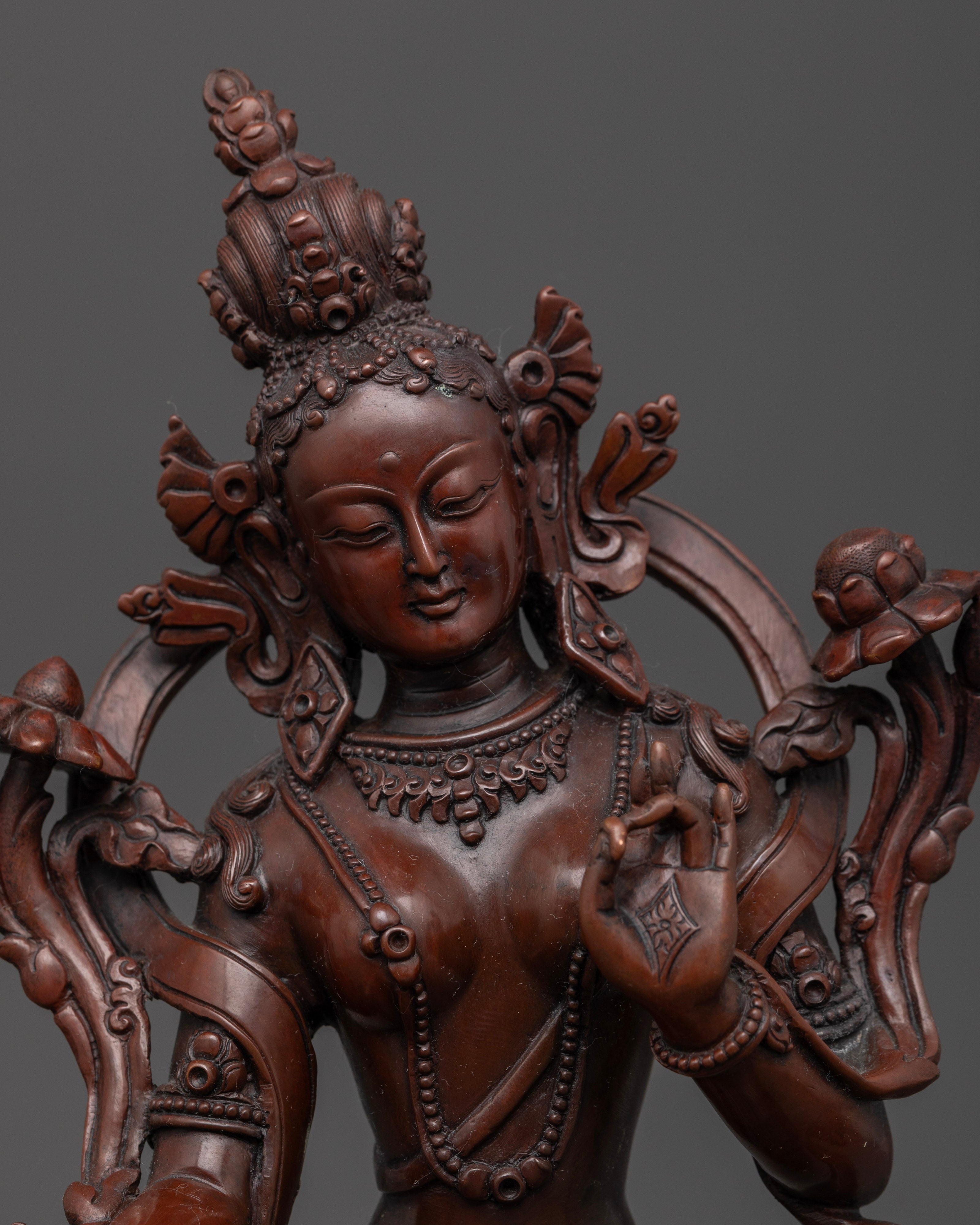 face of oxidized green tara statue fit for outdoor home decor