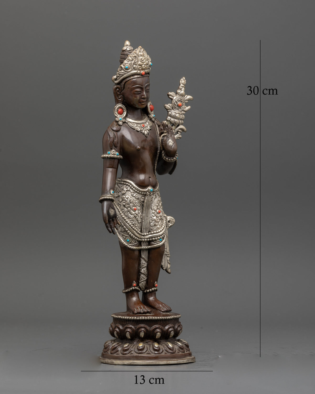 Padmapani holding utpala flower with five jeweled crown.
