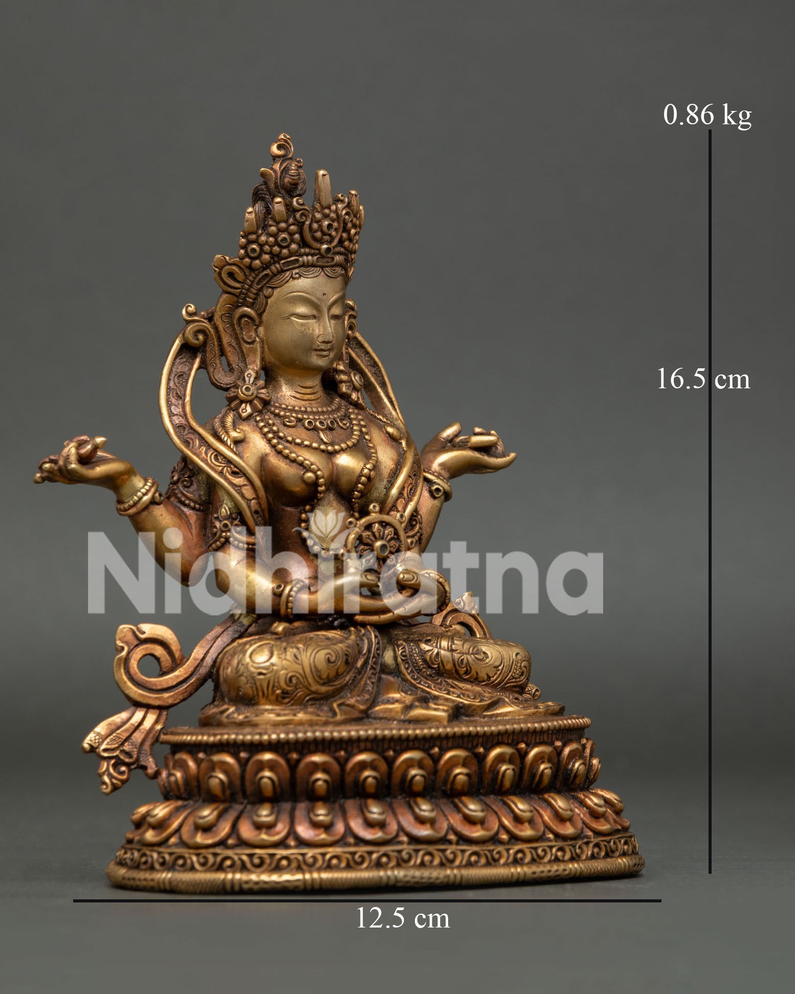 Prajnaparamita statue seated on double lotus pedestal with four arms.