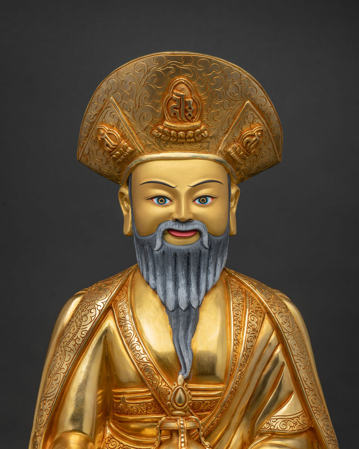 Radiant close-up of the Zhabdrung Rinpoche statue's gold fire-gilded copper finish