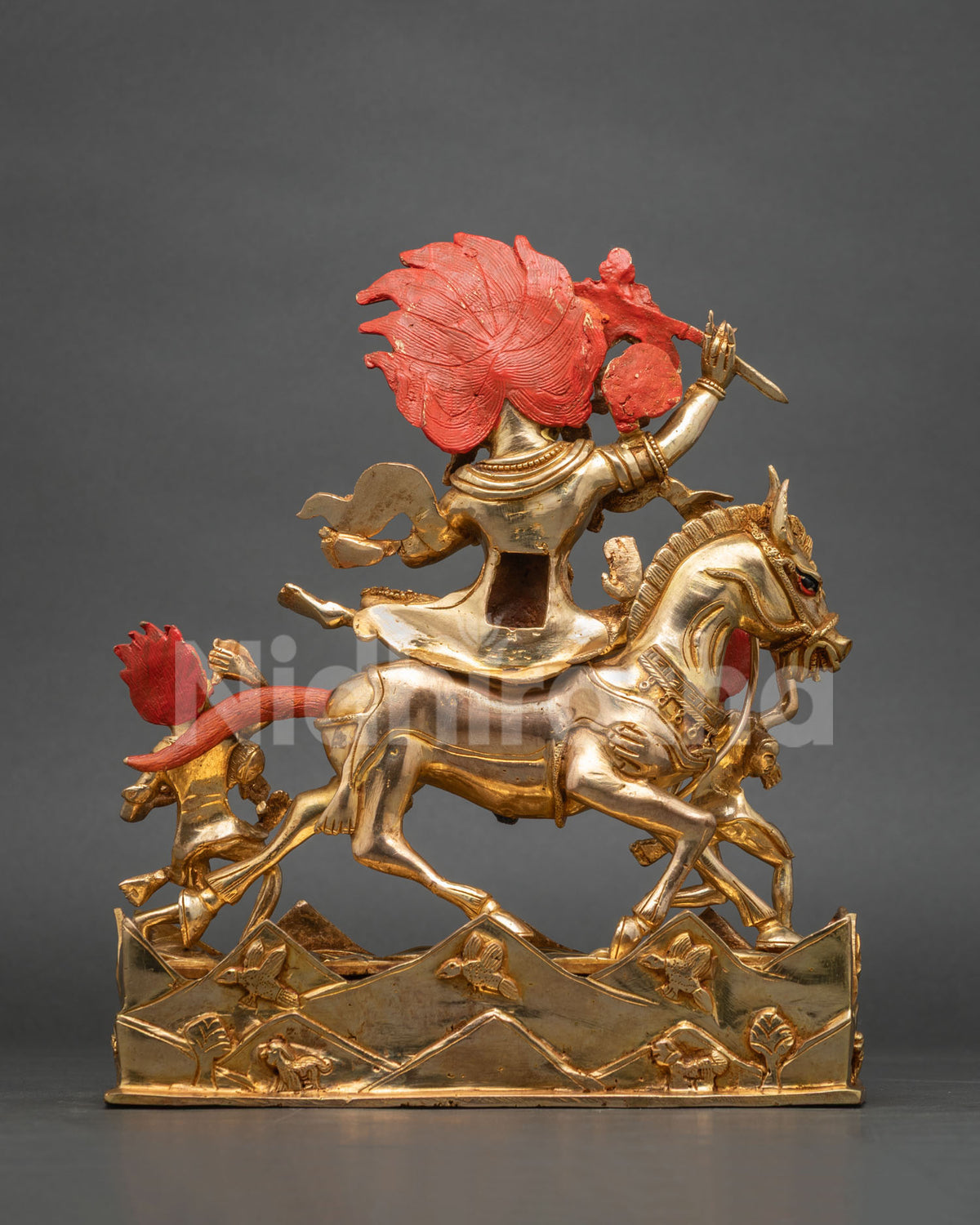 Rear angled view of Palden Lhamo statue on mule with carved mountain and bird base