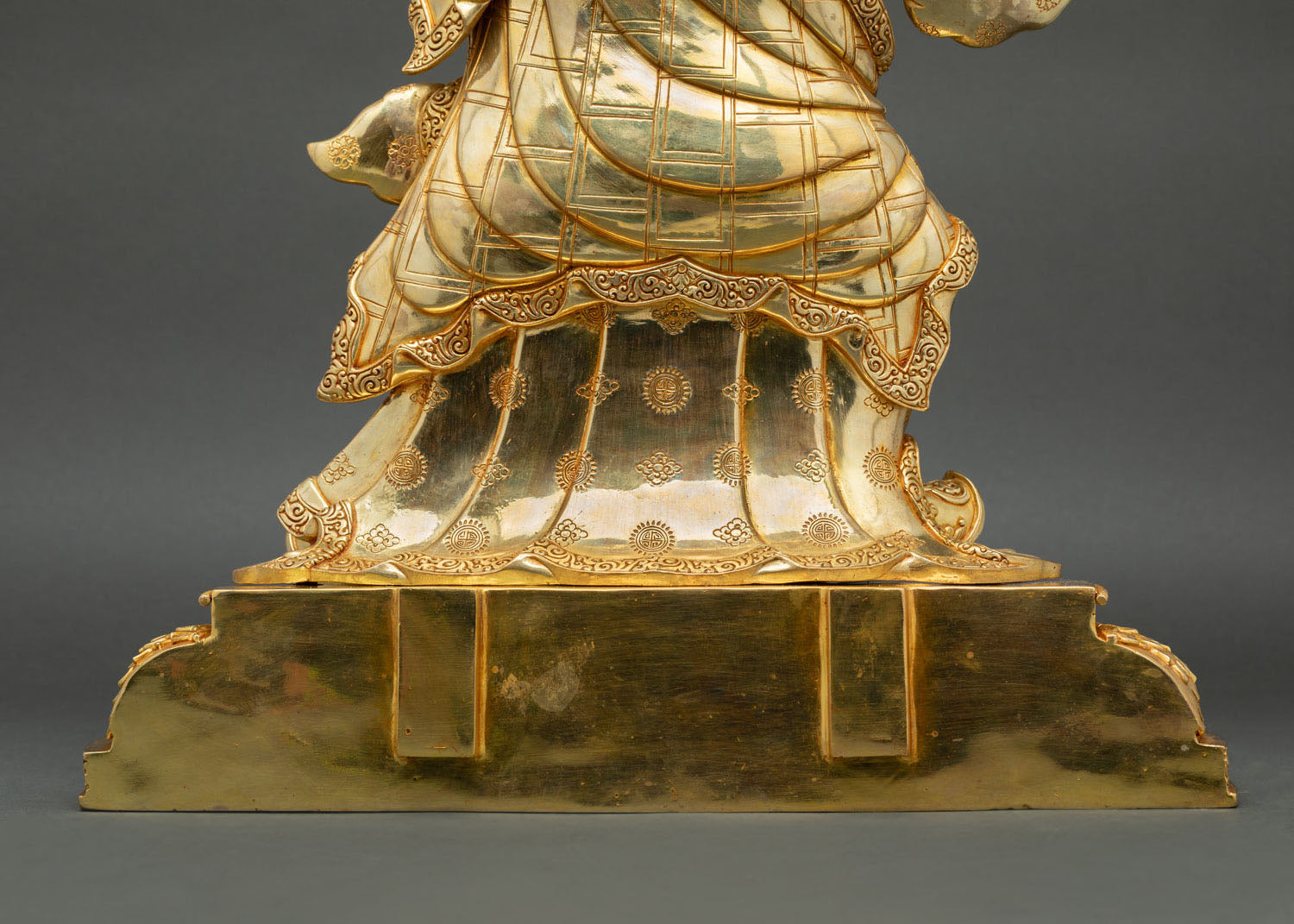 Rear base of standing Guru Rinpoche statue with handcrafted bronze pedestal details