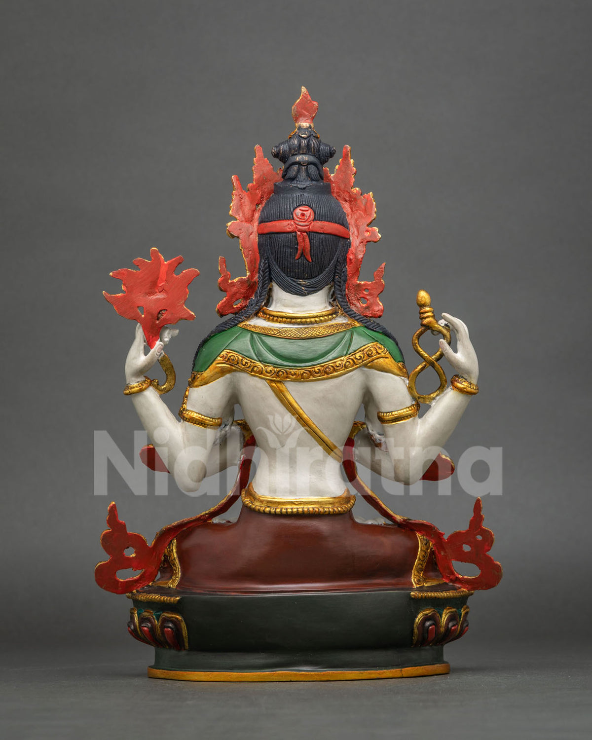 Rear view of Chenrezig statue showing red flame halo, green shawl and back details