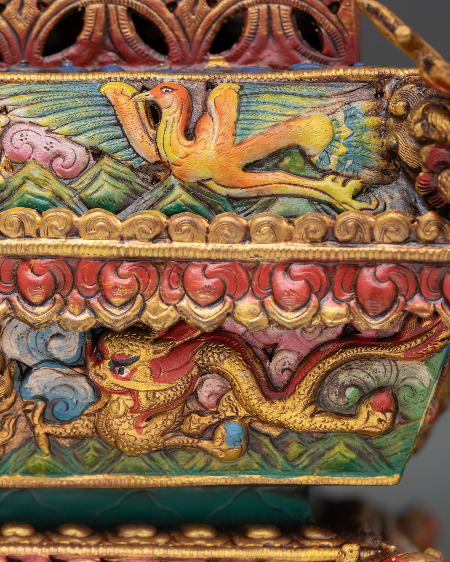 rear view of decorative incense burner showing engraved auspicious symbols and fine metal craftsmanship