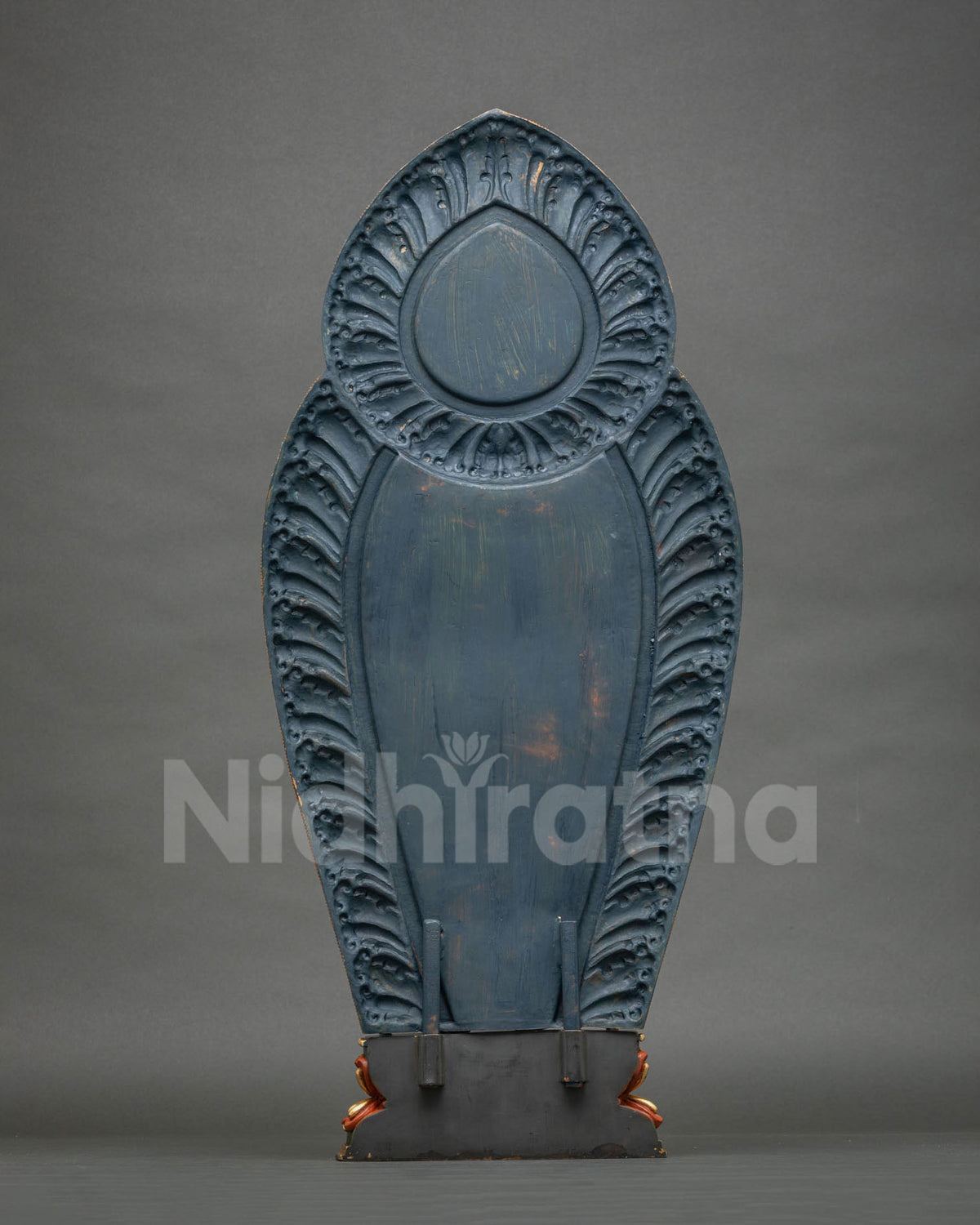 Rear view of Padmapani Lokeshvara statue halo with carved petal design and painted blue finish