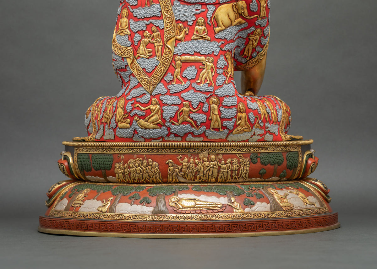 Rear view of Shakyamuni Buddha statue base carved with life scenes, trees, and the reclining Buddha