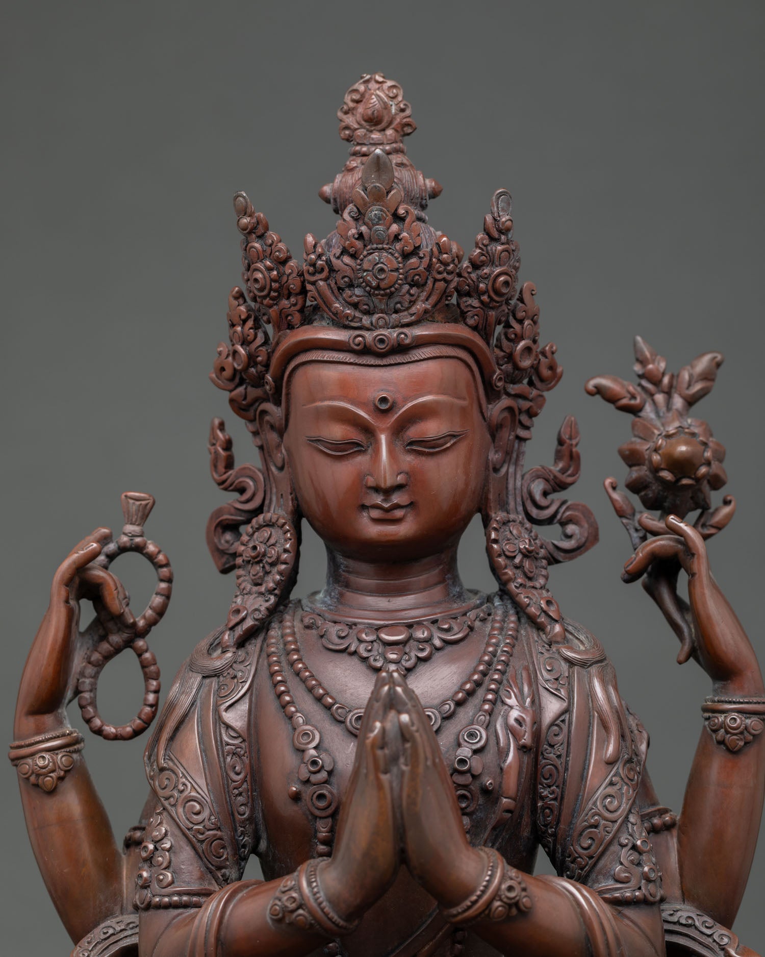 Regular close up of Chenrezig Avalokiteshvara statue showing handcrafted copper details