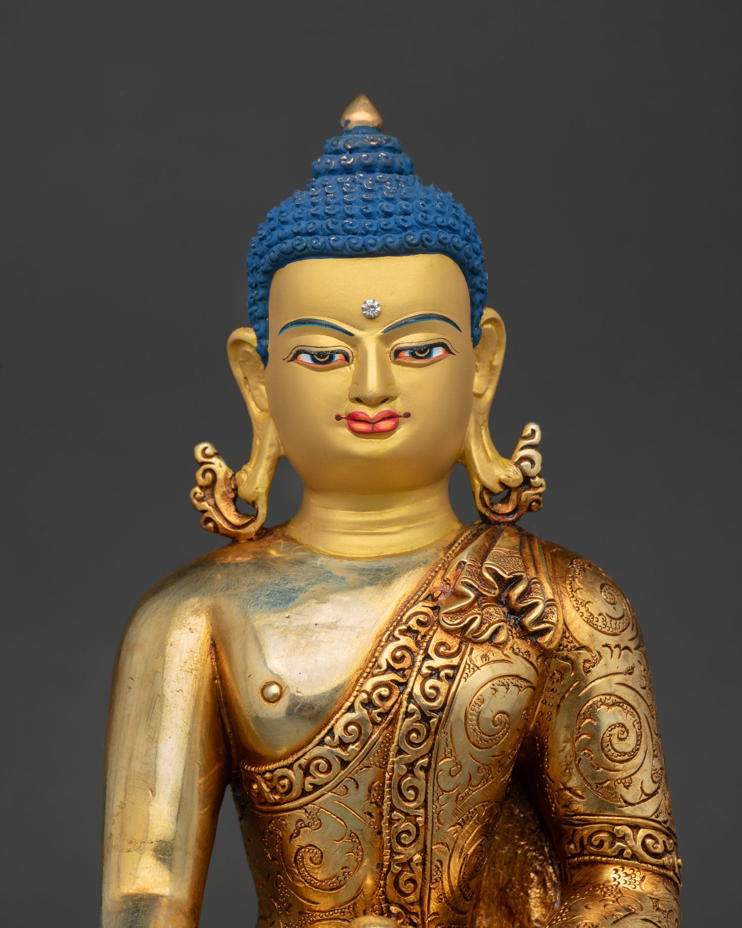 regular close up of shakyamuni buddha statue, copper alloy with layered gold fire-gilding details
