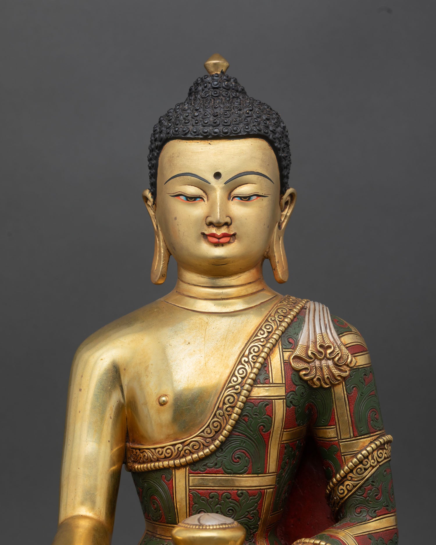 regular close up of shakyamuni buddha statue with alms bowl and serene posture