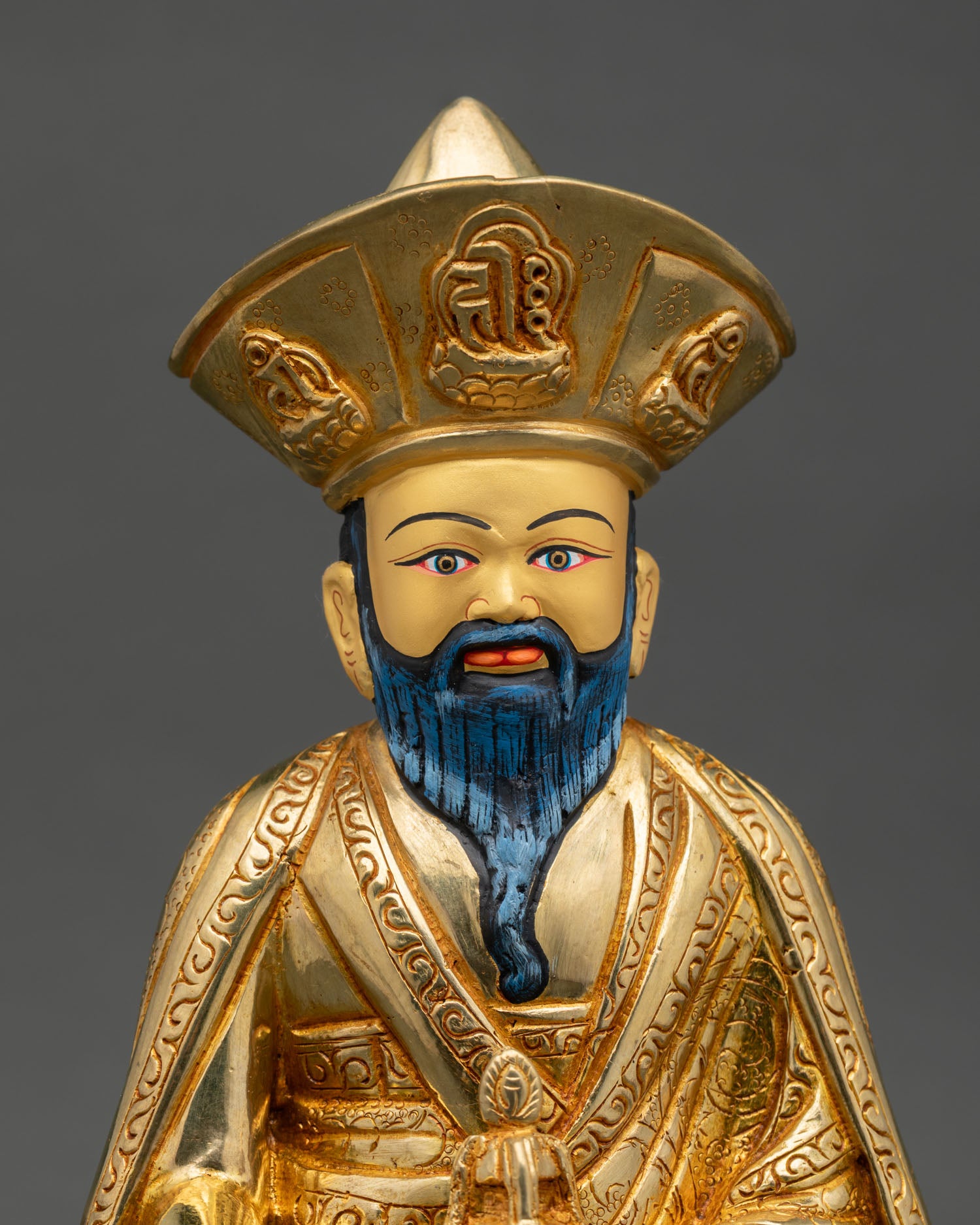 regular close up zabdrung ngawang namgyal statue intricate copper details fire gilded