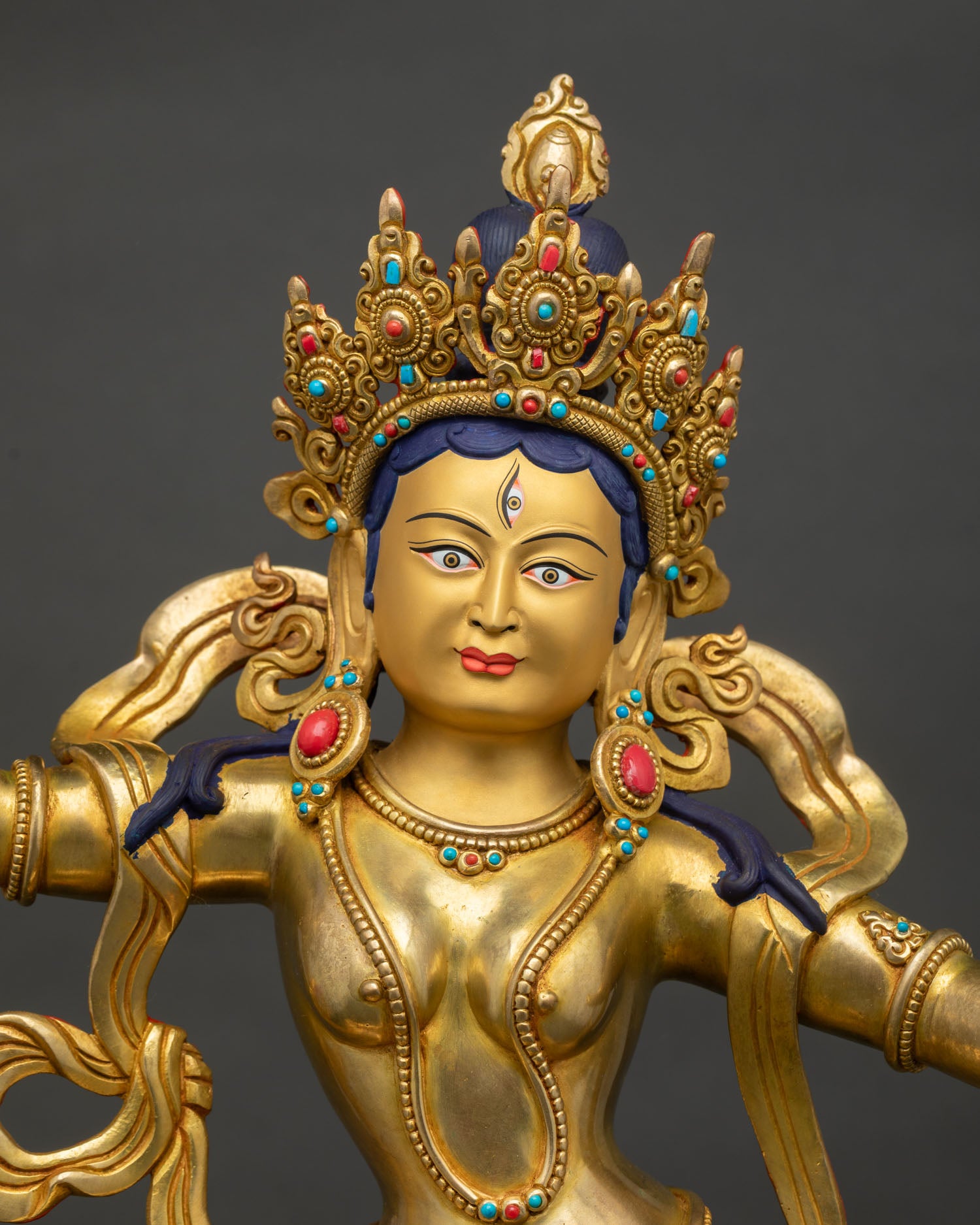 regular close up, detailed copper machig labdron statue showing Gold-painted face and intricate nepalese artisan craftsmanship