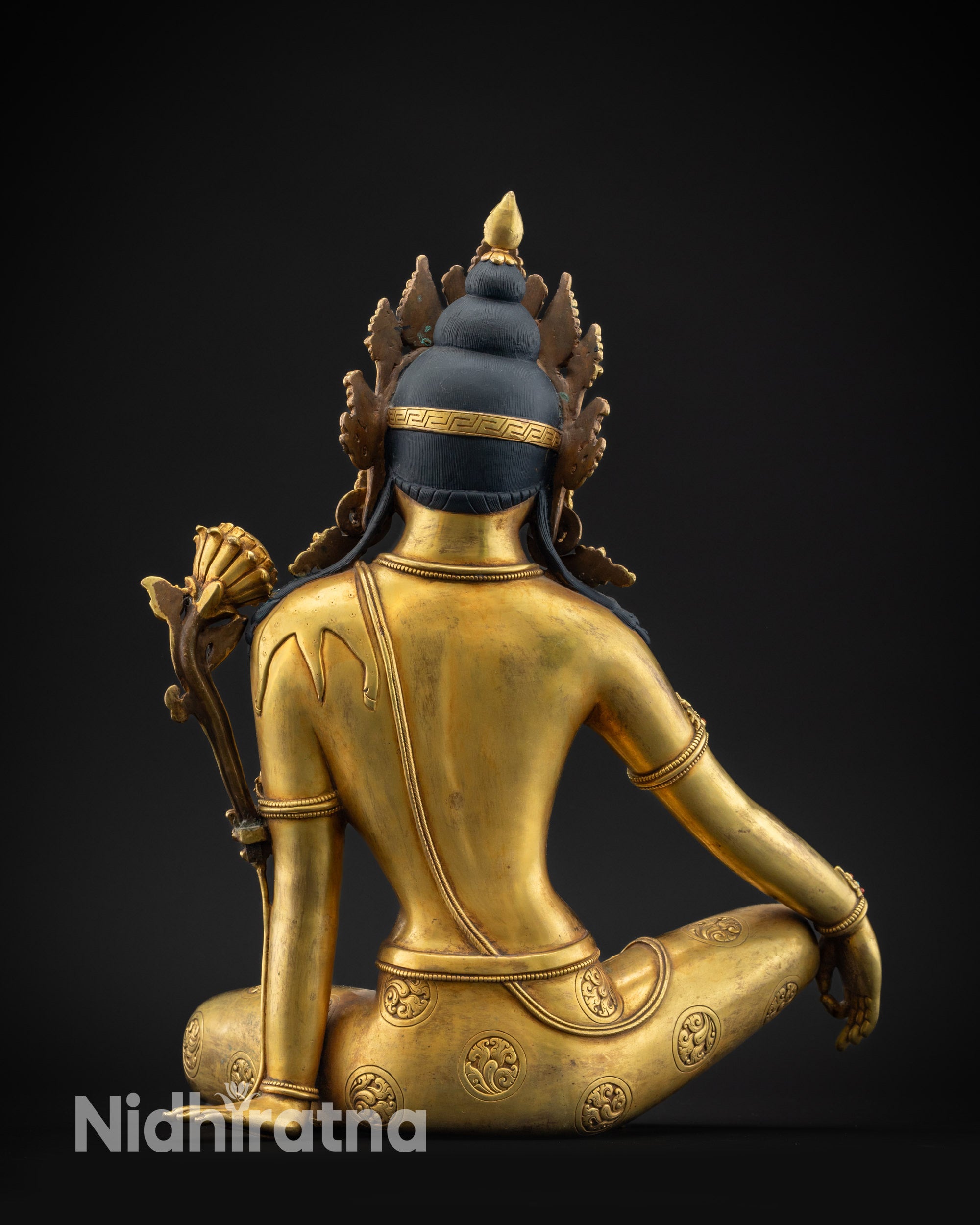 regular back view fire gilded chenrezig statue with detailed robe and hair