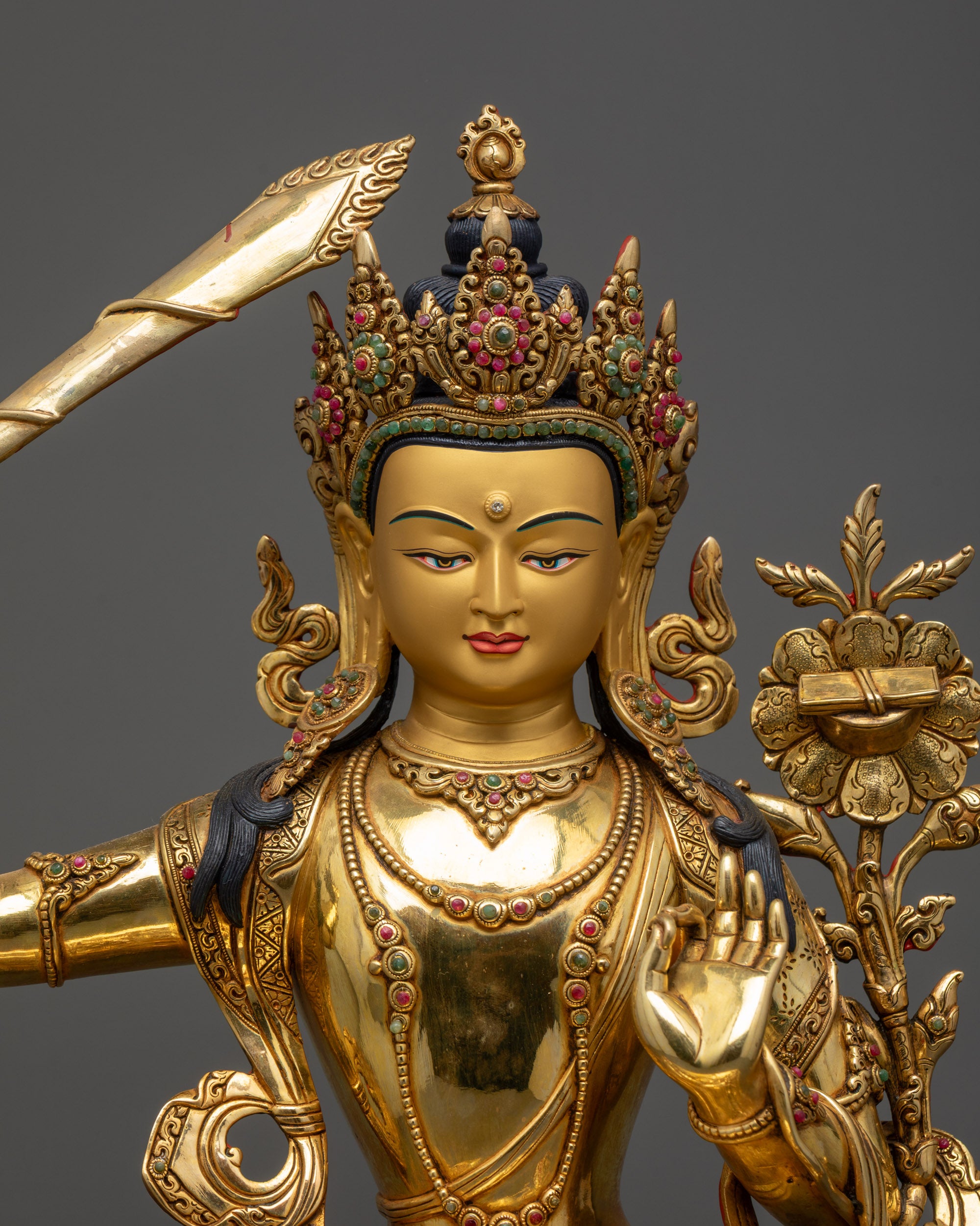 regular close up Manjushri Statue showing jeweled crown, halo and flowing robe details